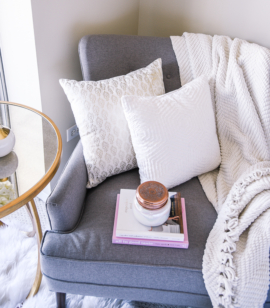 A white and gold accent pillows for your club chair.