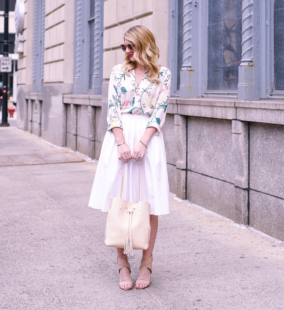 floral blouse for the office with a pleated white skirt