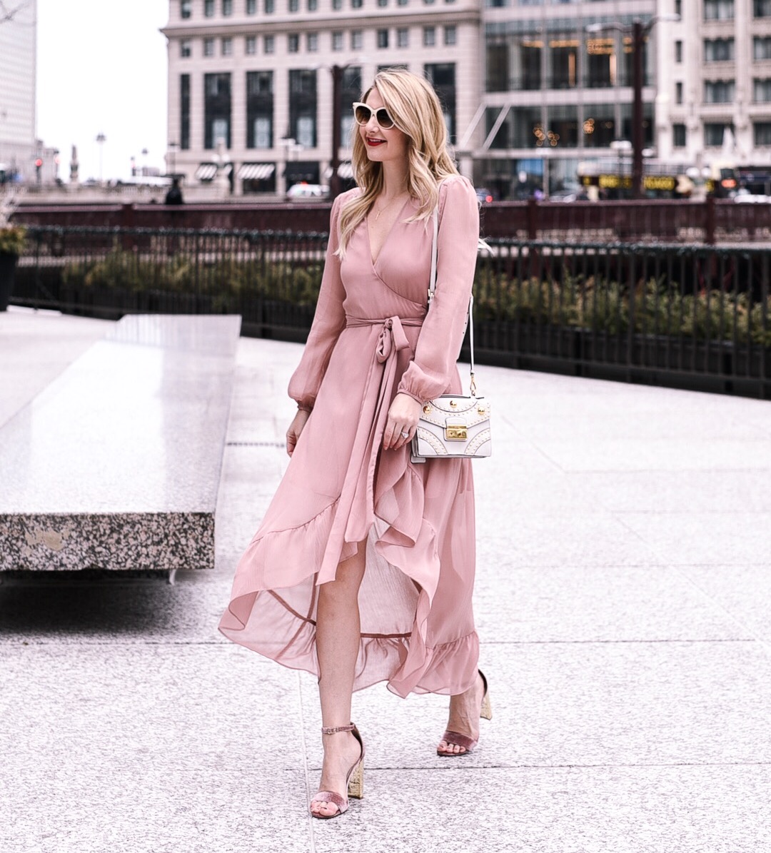 blush pink wrap dress with a ruffled hem 