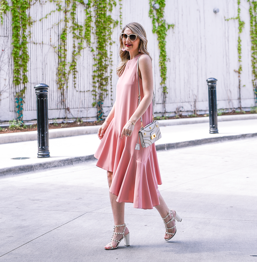 Pink ruffled hem dress with white tom ford sunglasses 