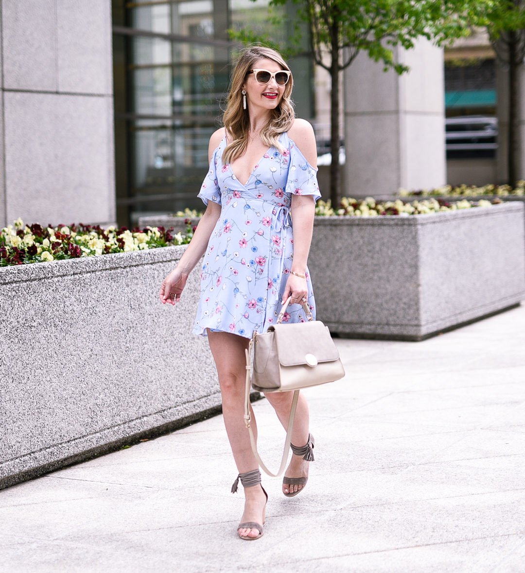 Walking through chicago in spring with a floral print dress for wedding guest style. 