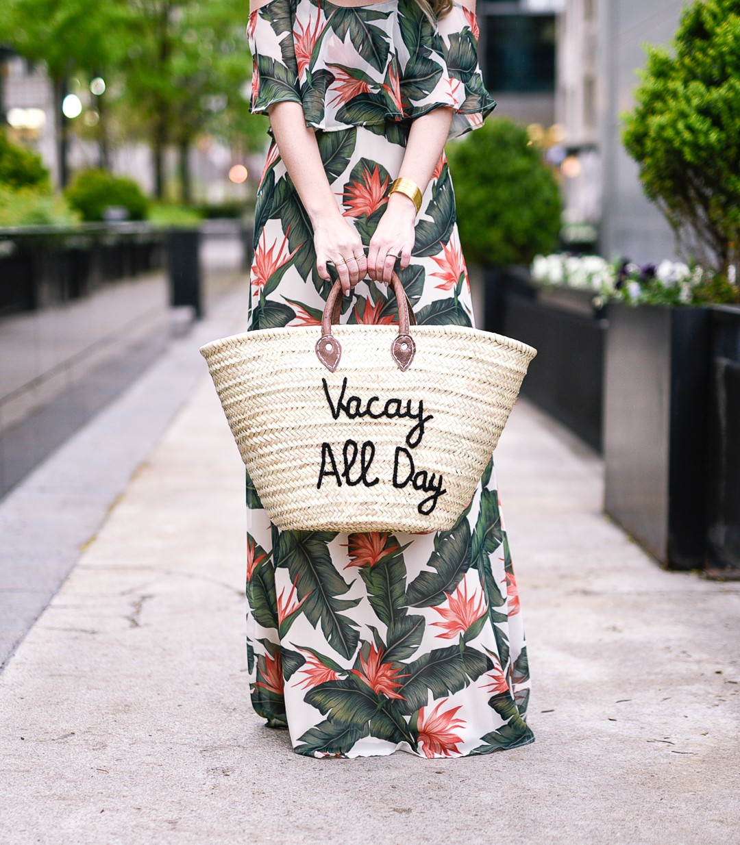Printed chiffon maxi dress with a woven straw oversized tote 