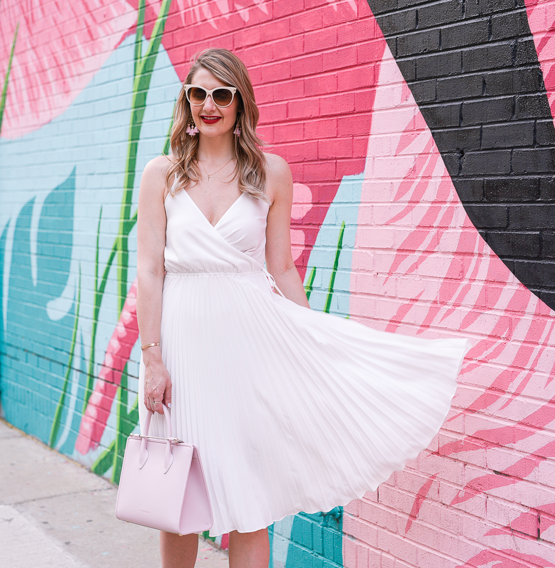 a little white dress with a pleated skirt