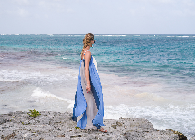 maxi dress on the cliffs of tulum mexico