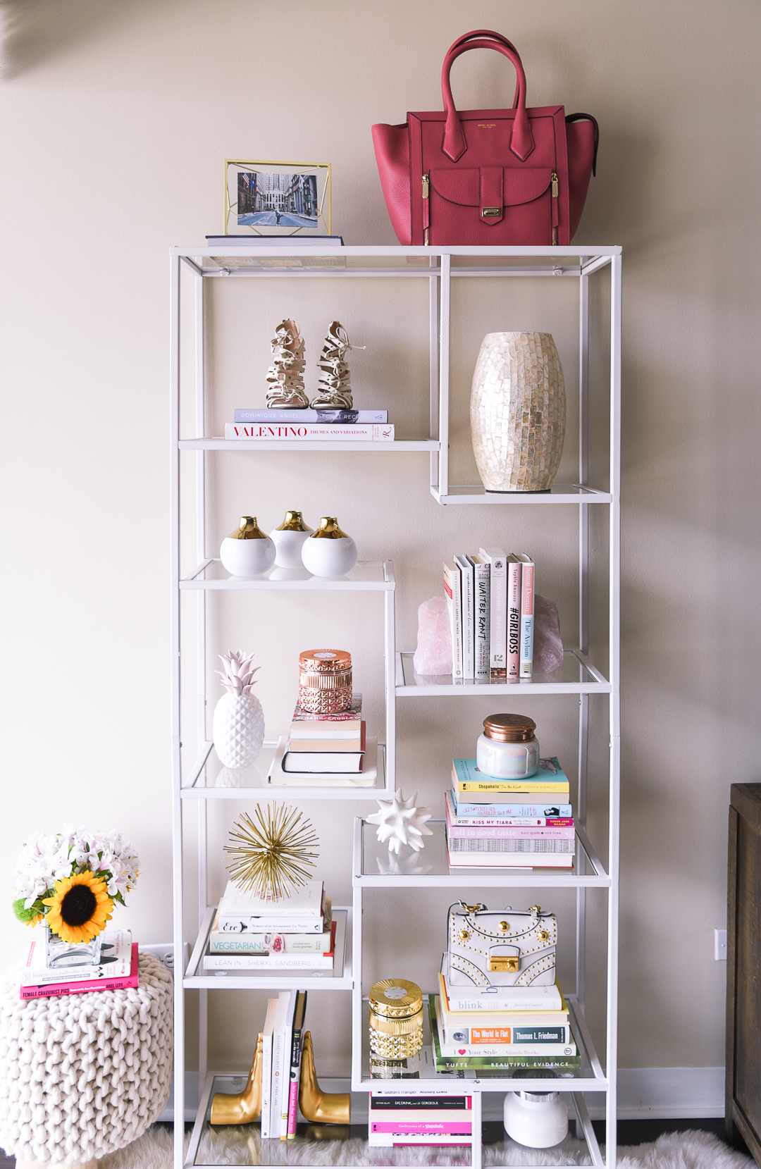 a white glass bookshelf