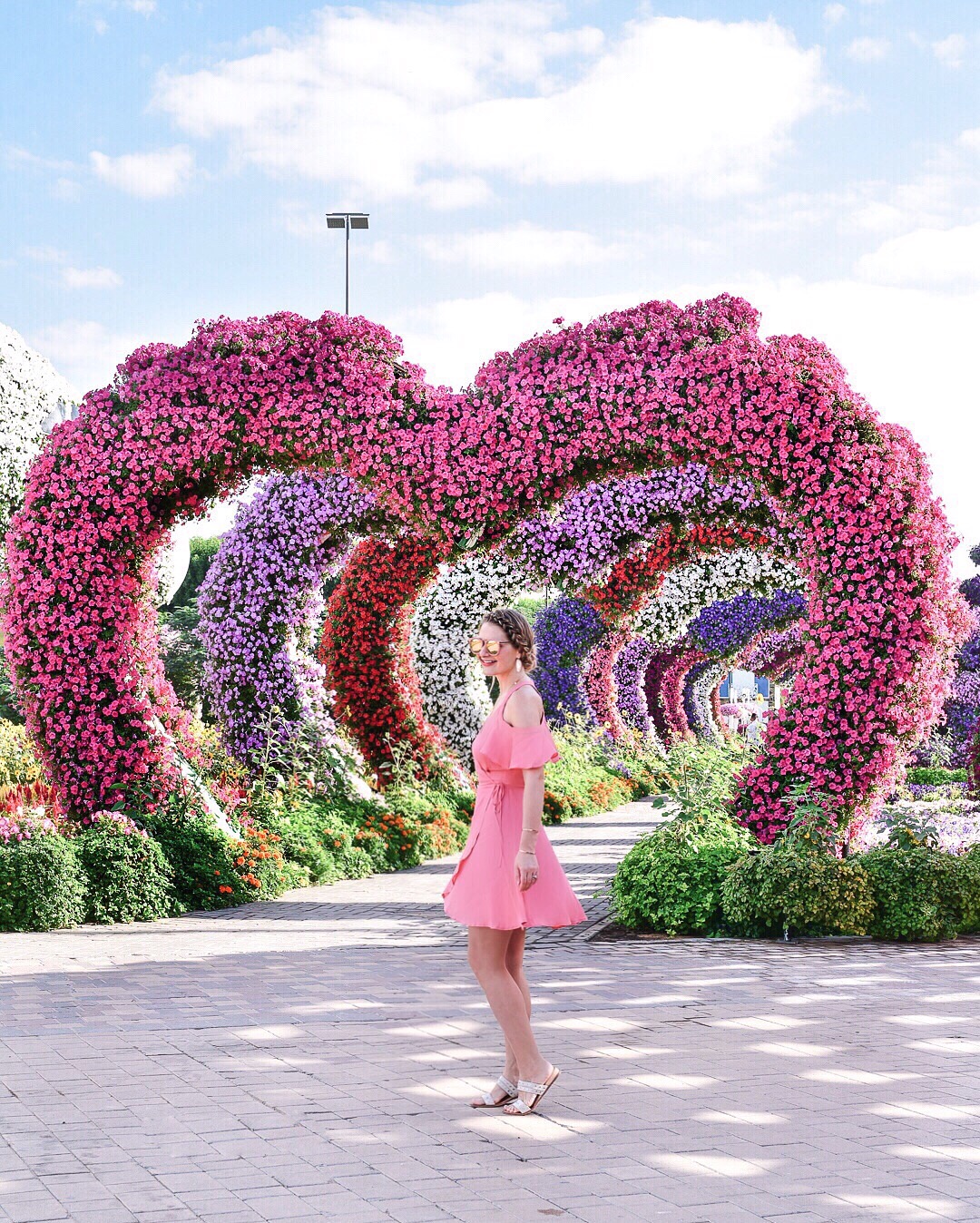 Dubai miracle garden in a privacy please pink dress