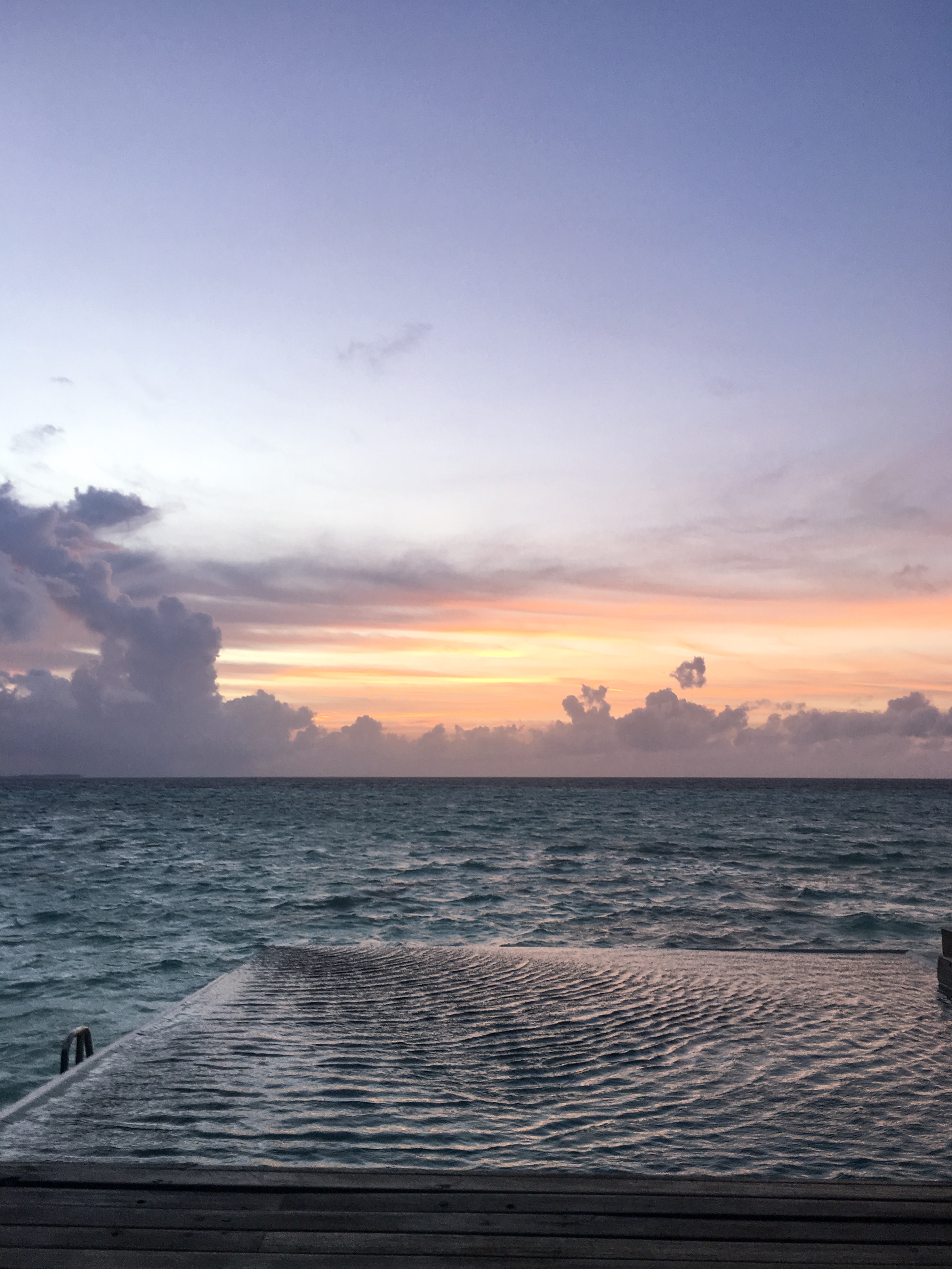 Sunset over the pool in the maldives