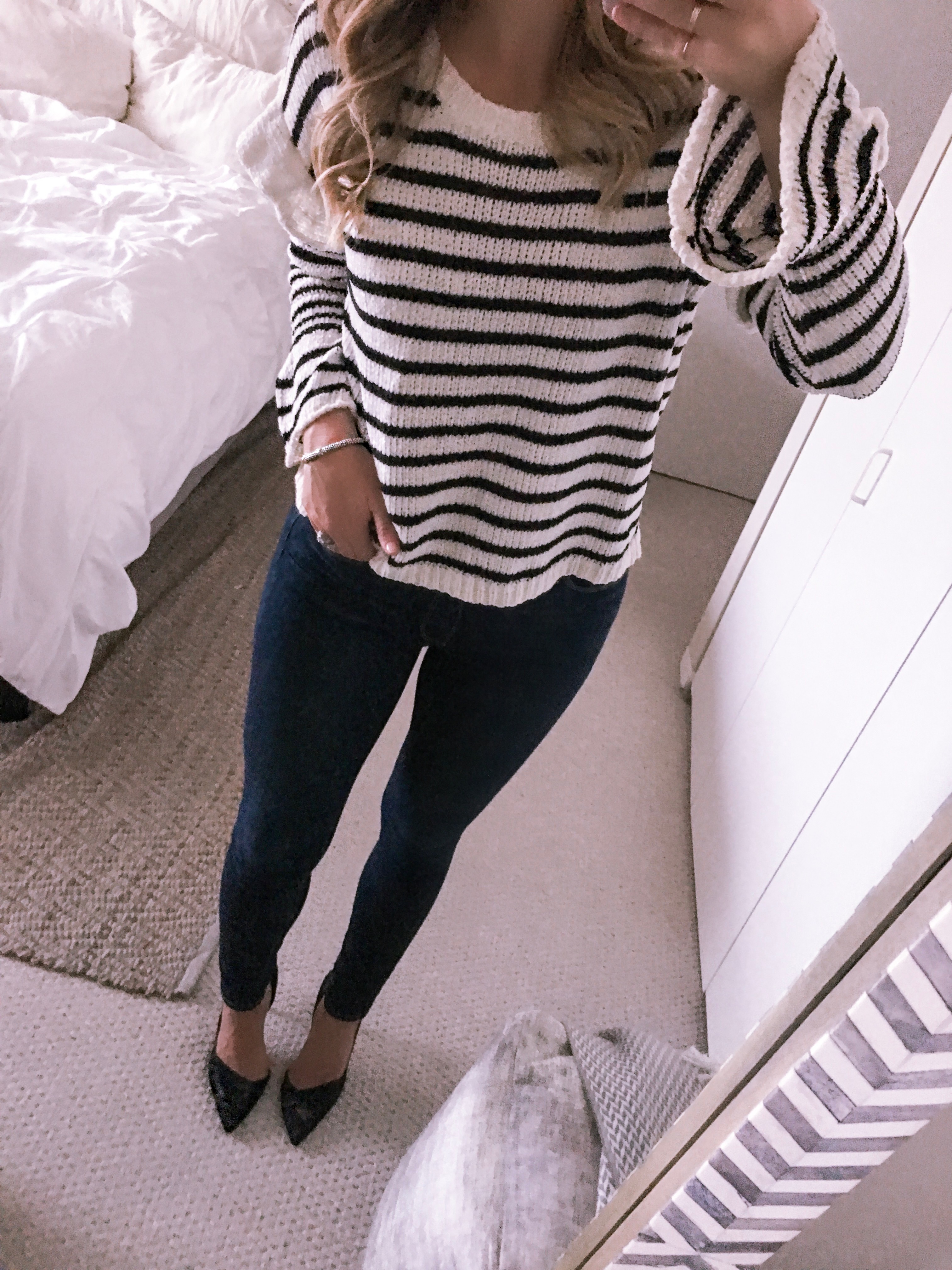 striped sweater and skinny jeans