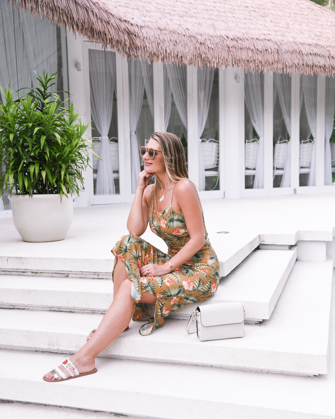 sincerely jules yellow floral print midi dress in the maldives at ayada resort