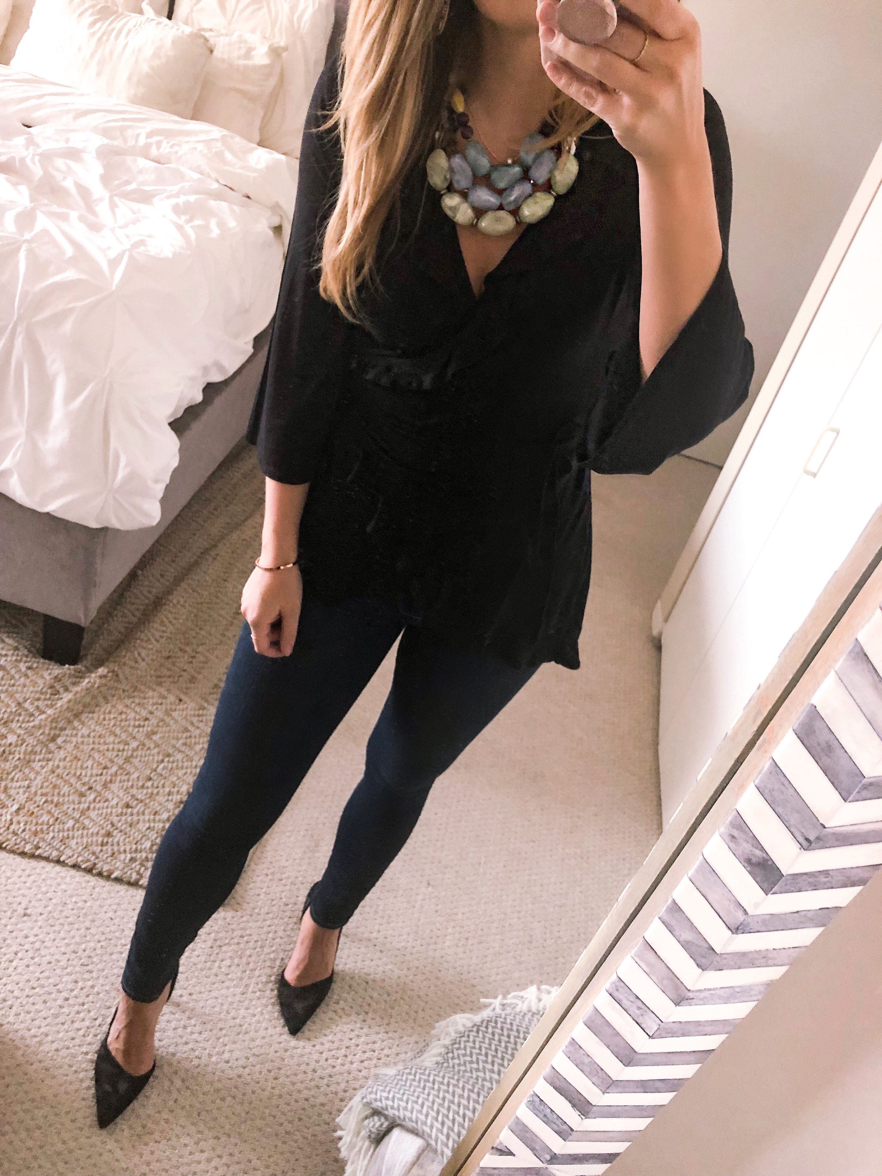 black wrap top with a statement necklace for date night outfit
