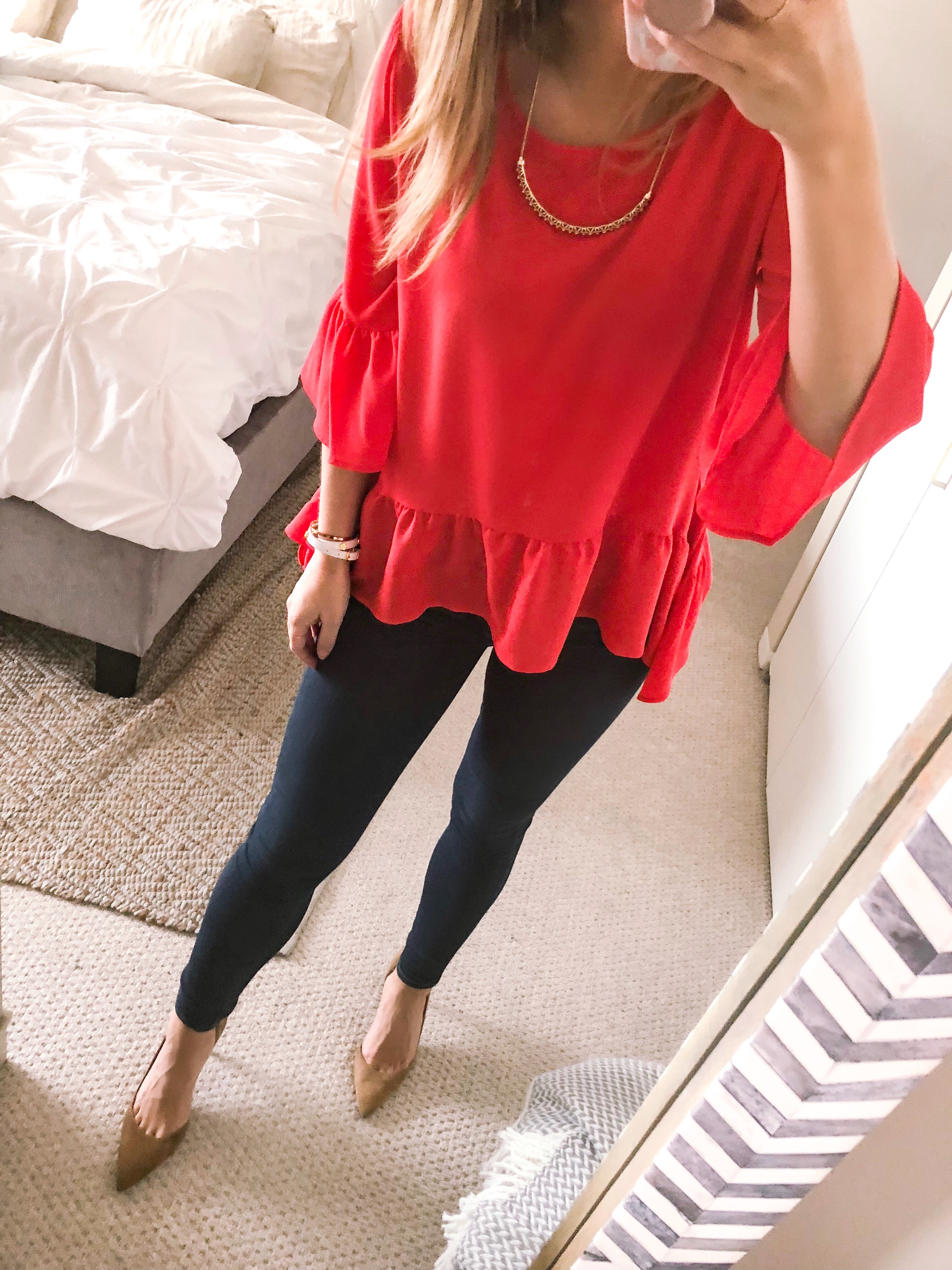 red ruffled top and dark wash skinny jeans