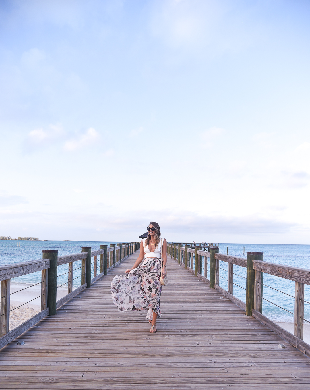 floral skirt with a white crop top - baha mar resort review in the bahamas by popular Chicago travel blogger Visions of Vogue
