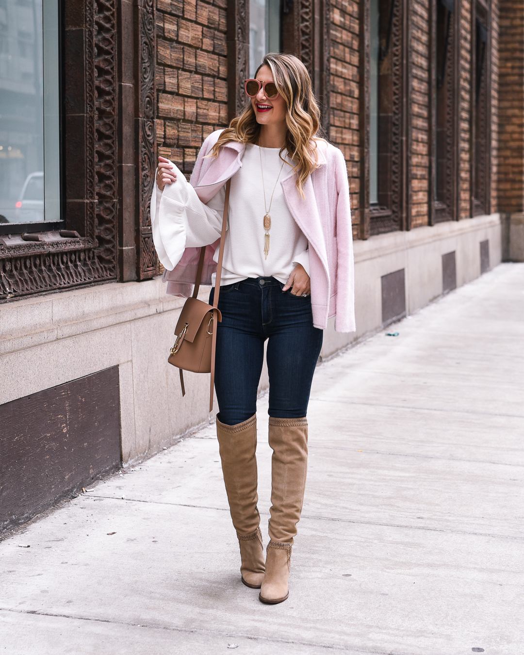 white bell sleeve top and pink moto jacket