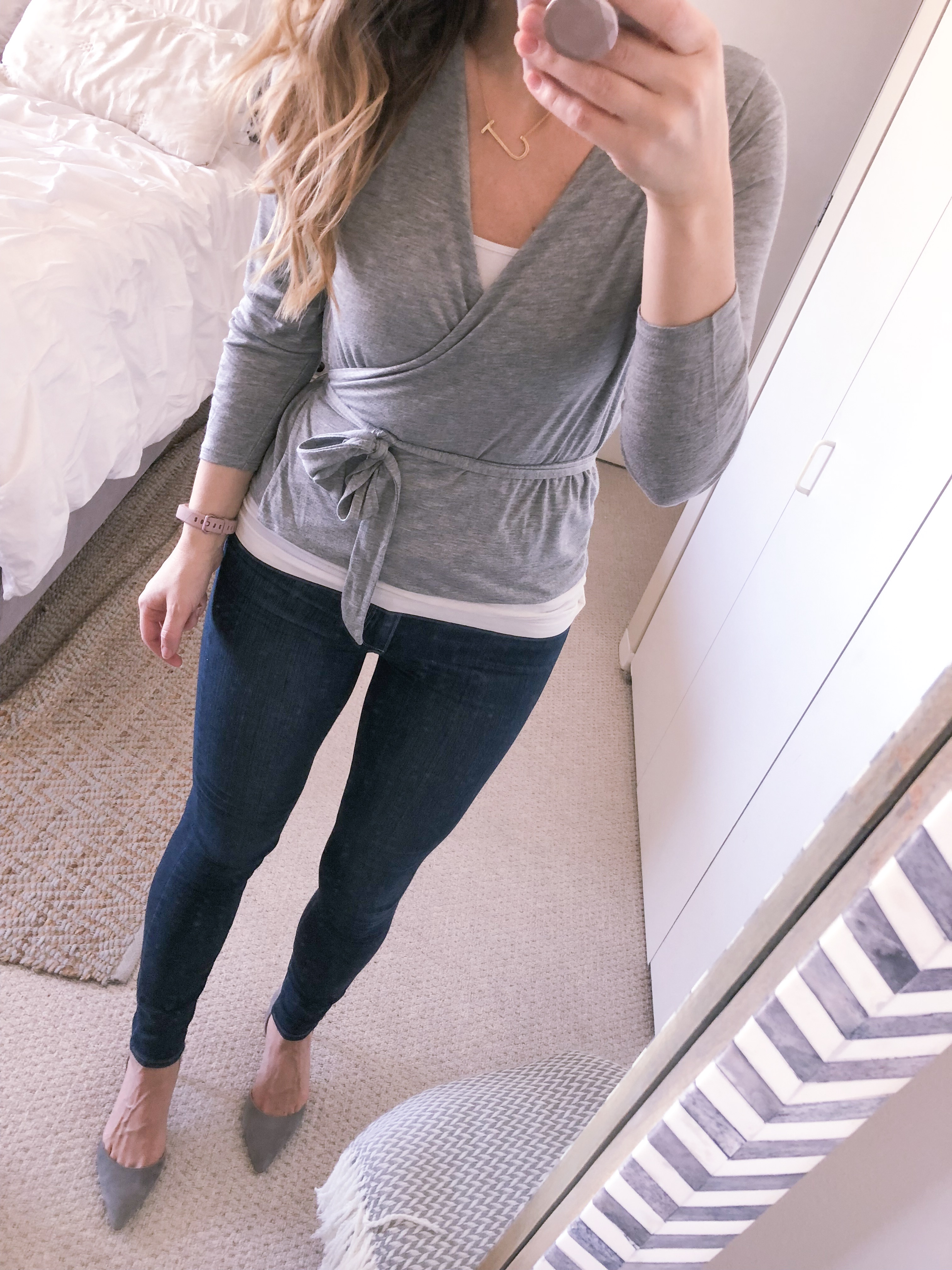 j.crew grey wrap top with high waisted skinny jeans and grey suede pumps