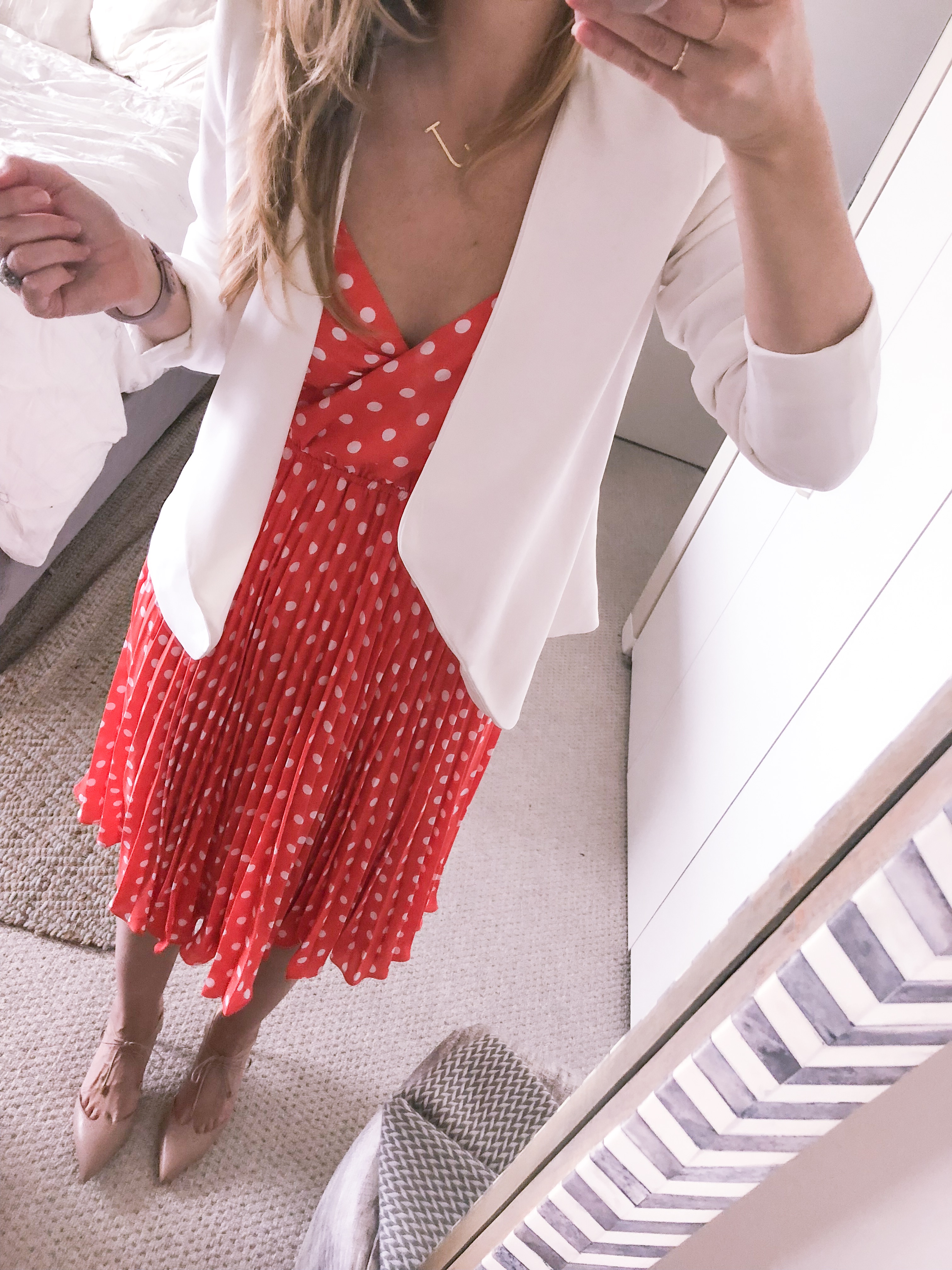 orange polka dot dress with a white blazer