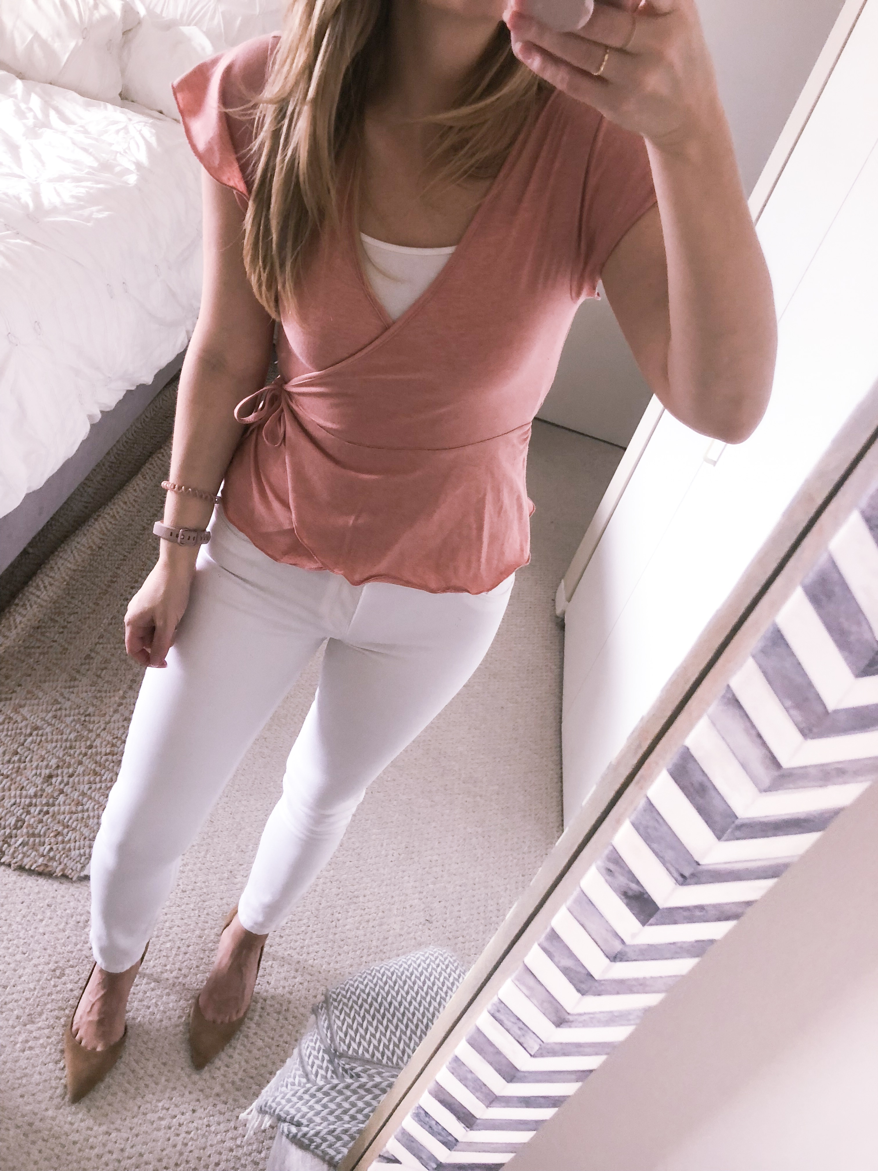 Flutter sleeve pink wrap top with white skinny jeans