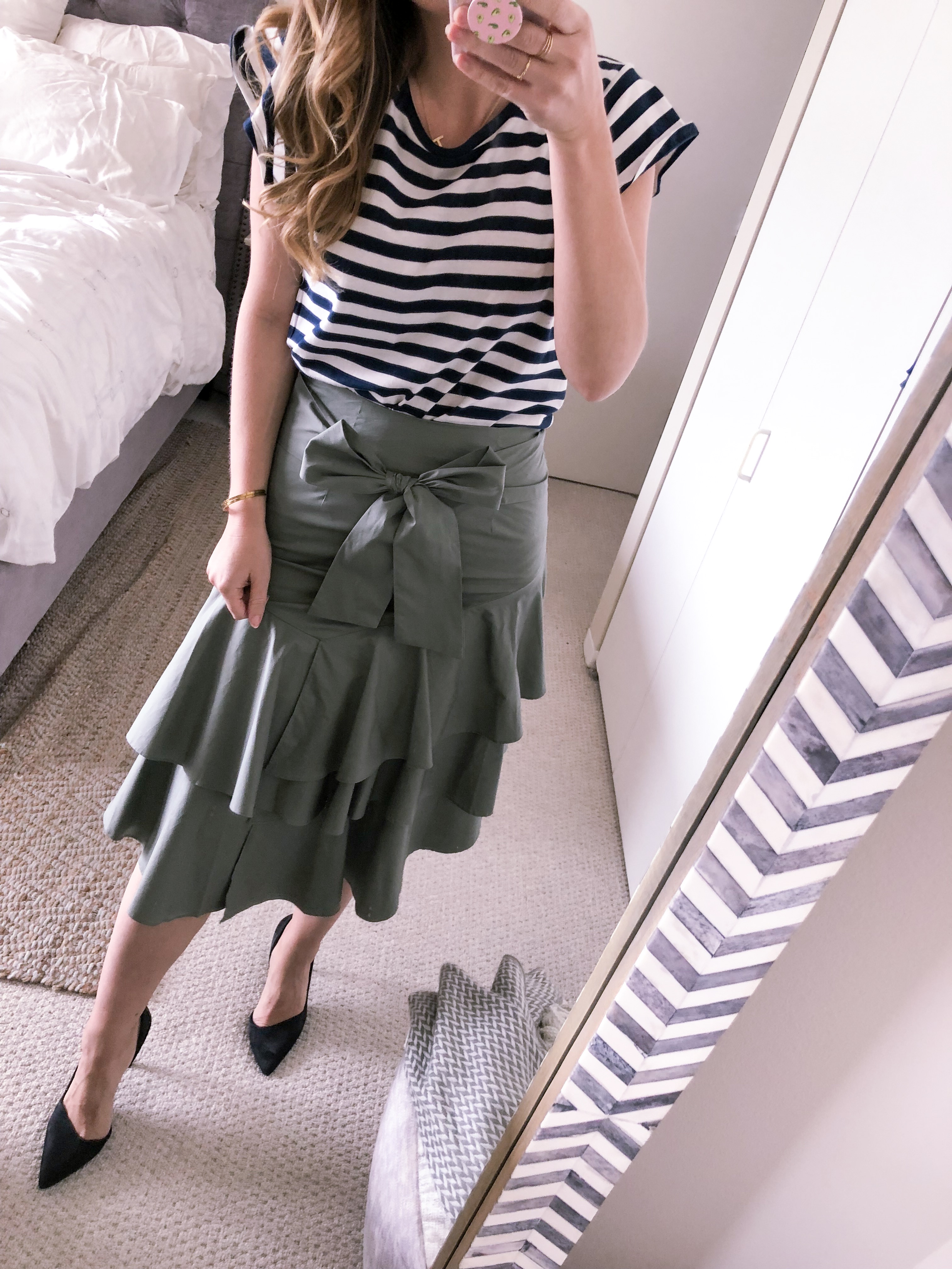 olive ruffled skirt with a navy striped top