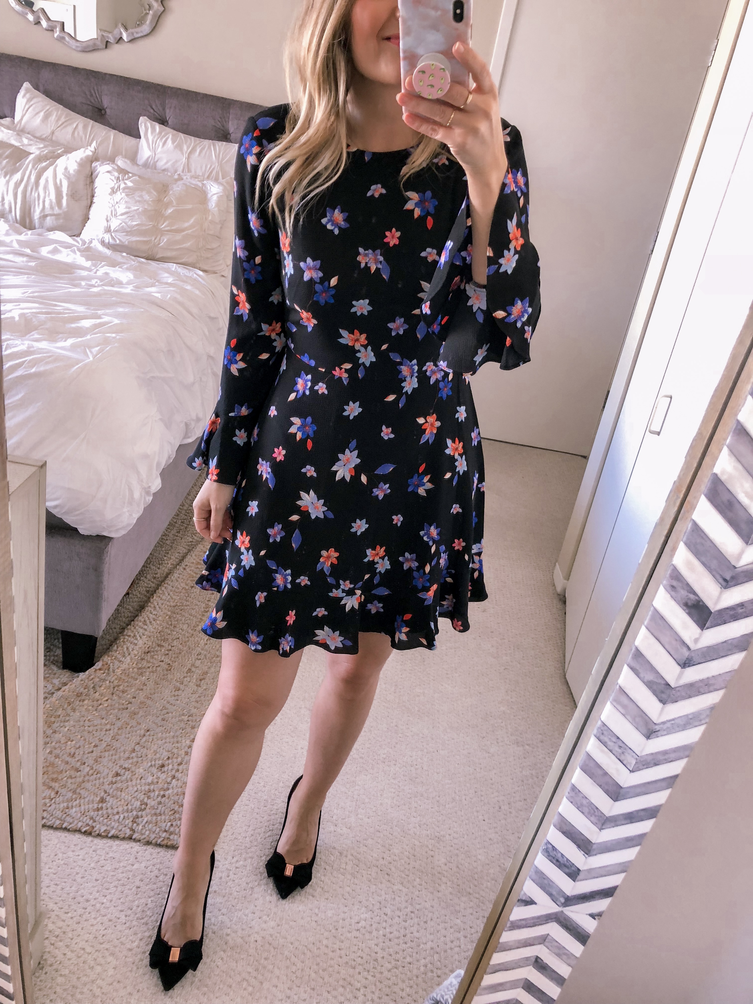 Popular Chicago fashion blogger Jenna Colgrove wears a fall floral dress with black Ted Baker pumps for a work office outfit idea.