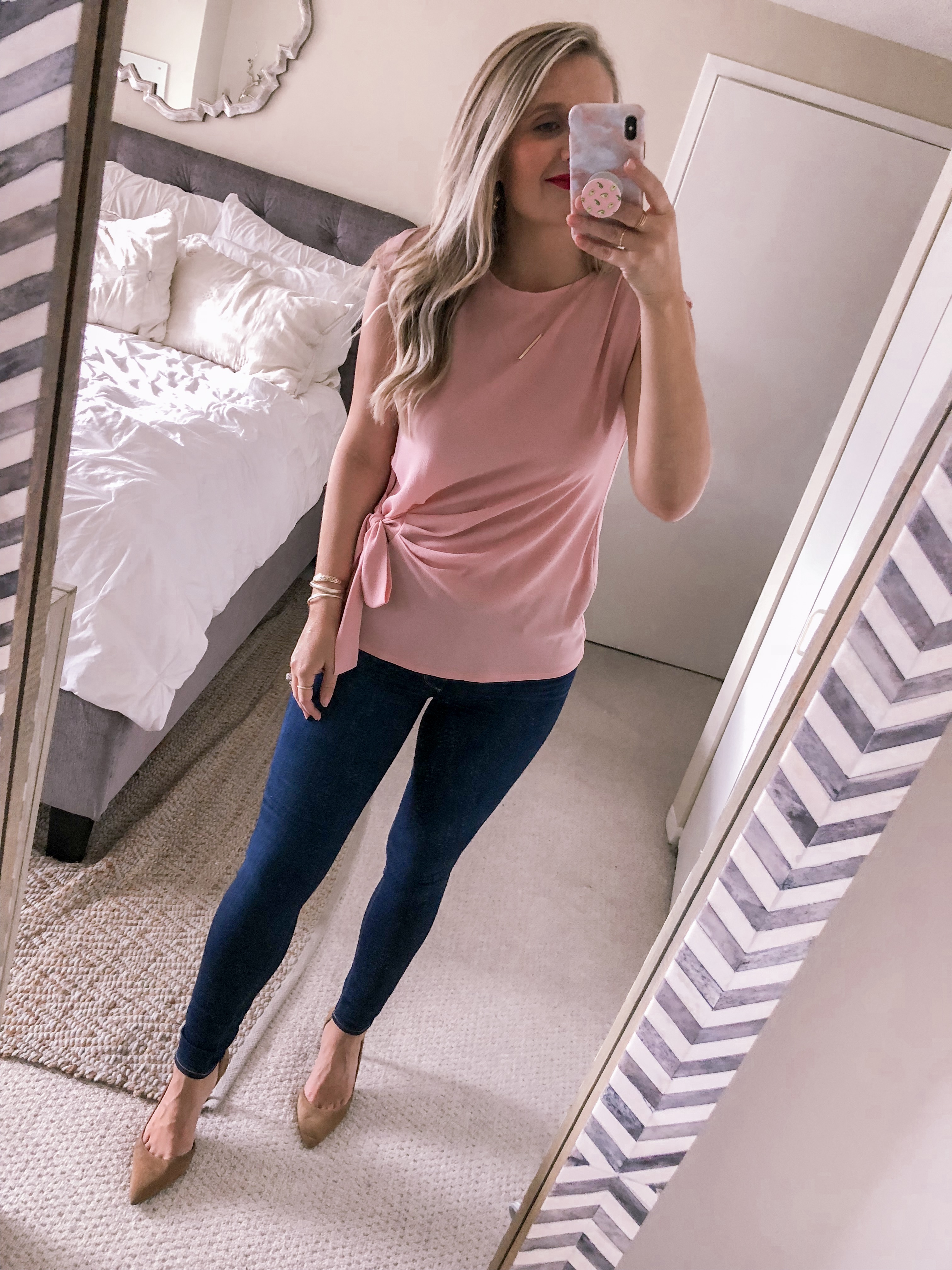 Chicago fashion blogger wears a pink work top to the office.