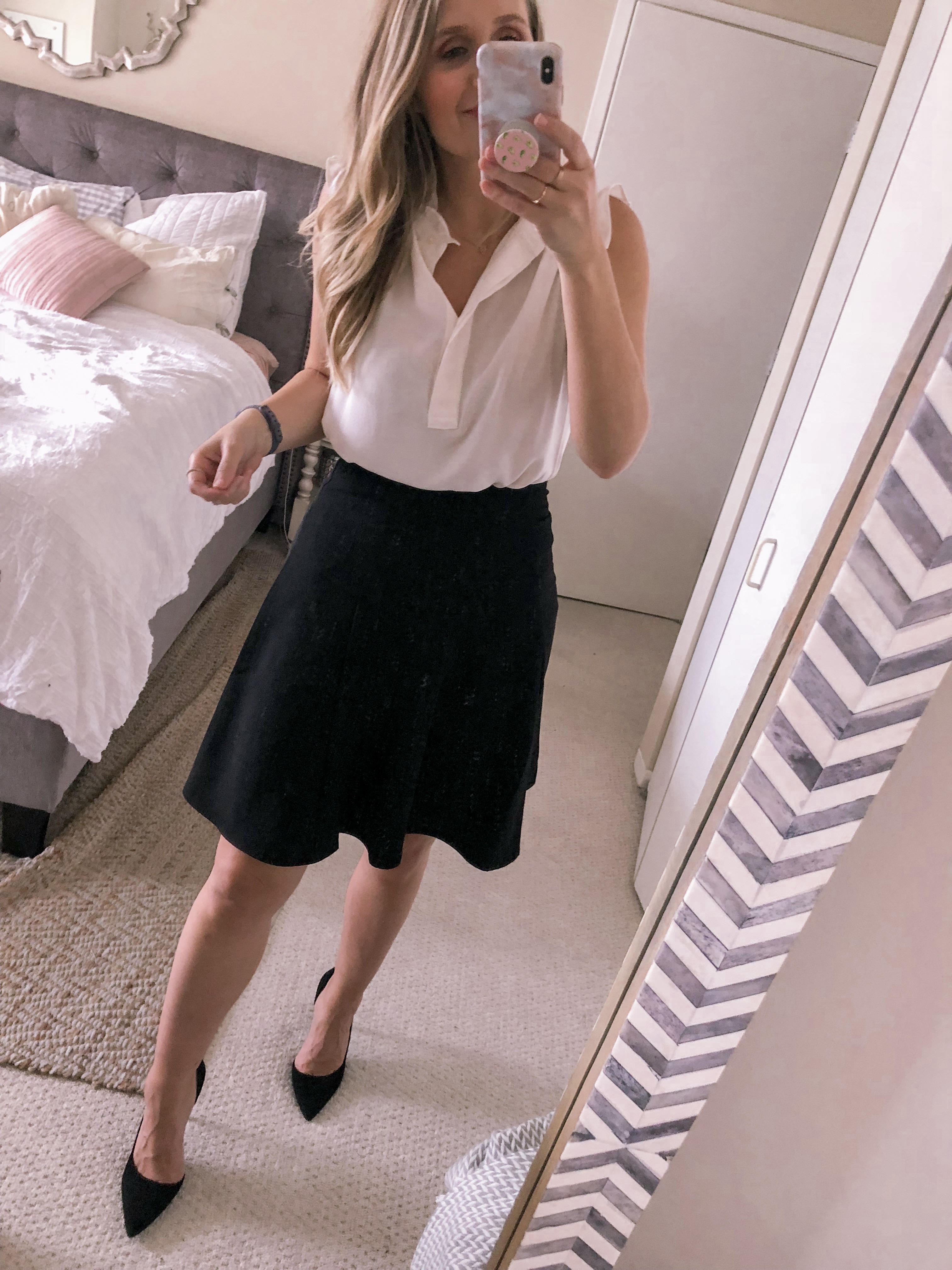 Chicago fashion blogger Visions of Vogue wears a white ruffle LOFT tank top with a CeCe black A-line skirt and black suede pumps for an office outfit idea.