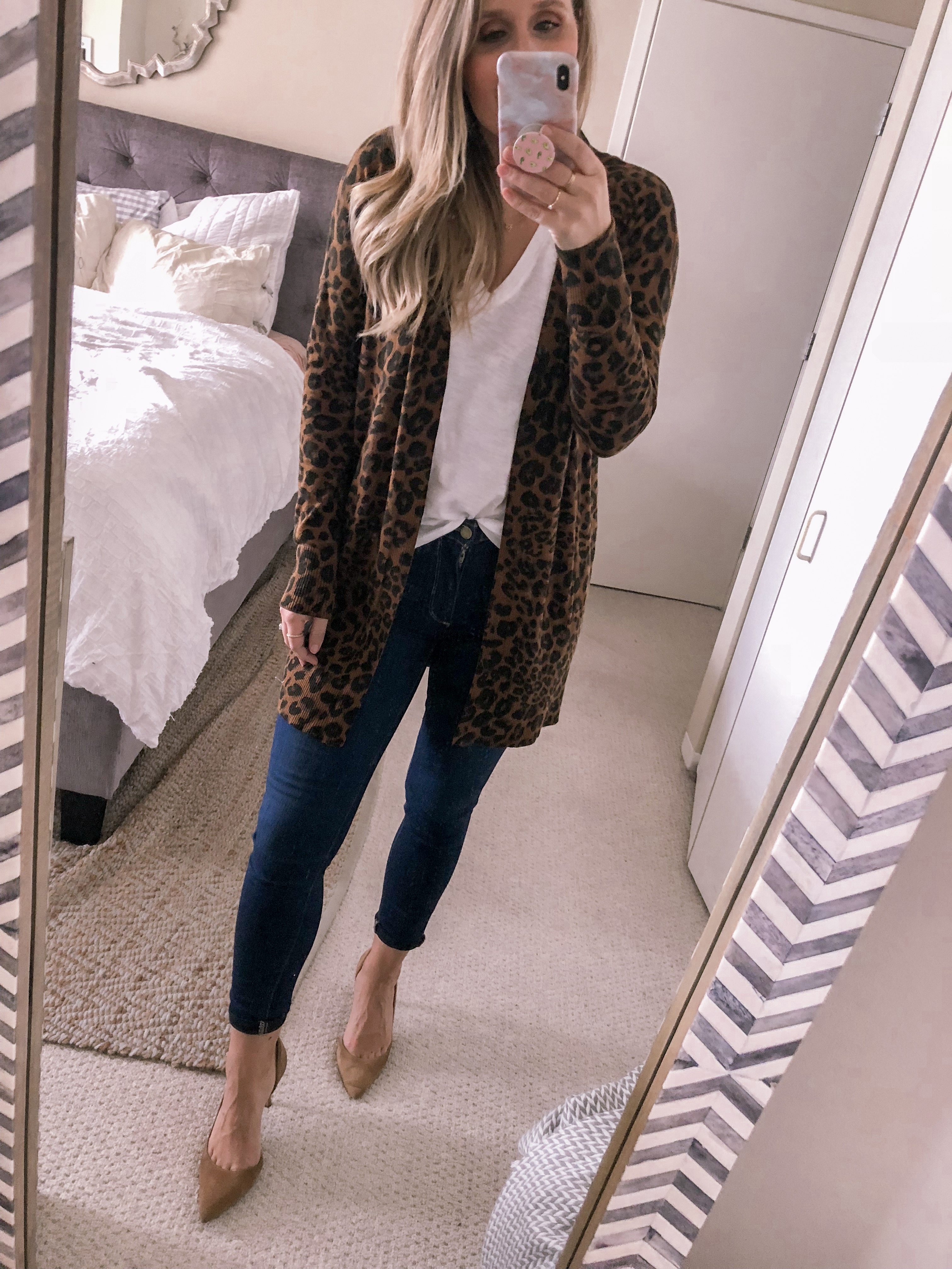 Popular Chicago blogger Visions of Vogue styles a leopard cardigan with the Madewell Whisper tee and beige pumps for a fall office outfit look.