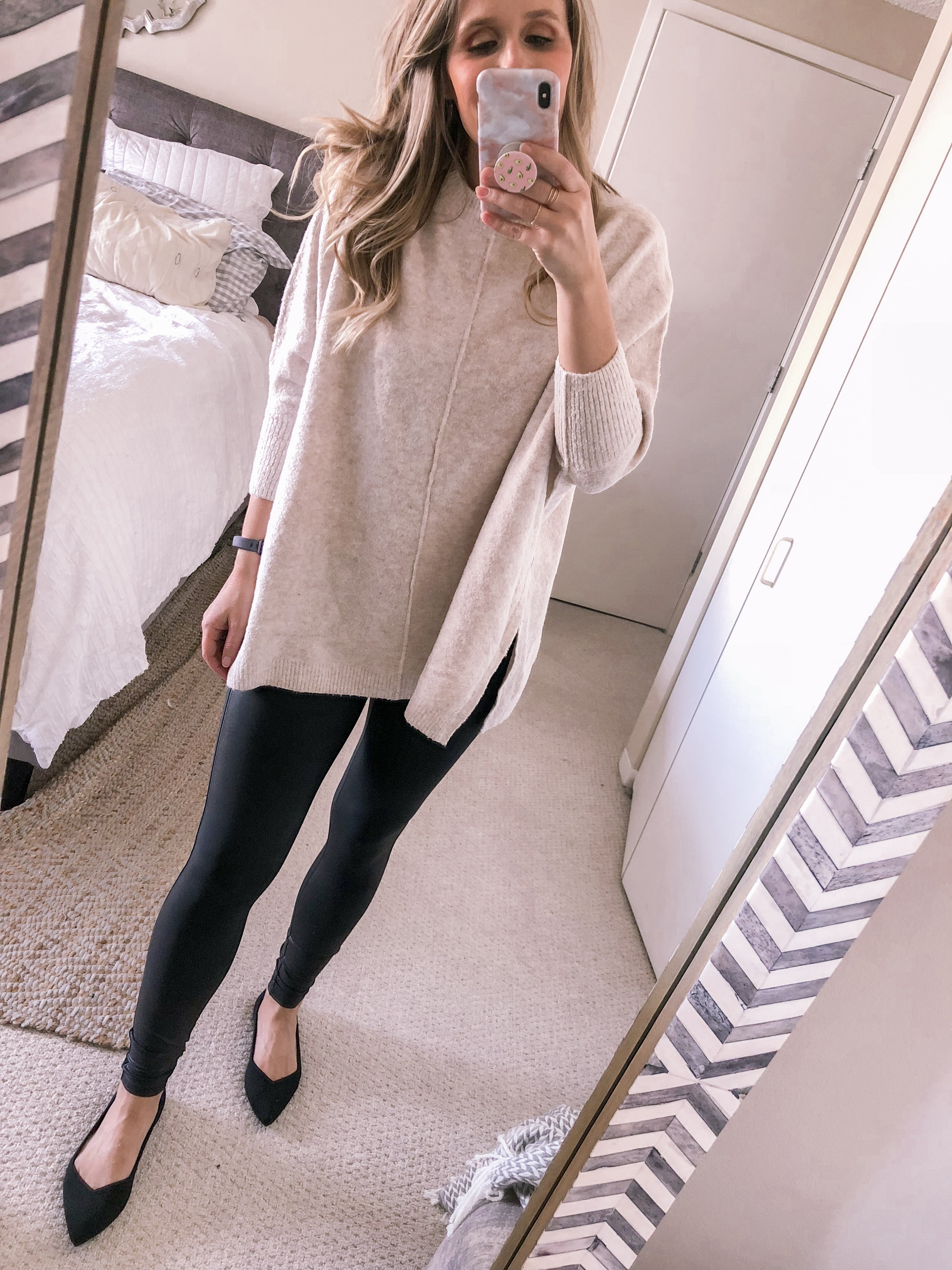 Chicago fashion blogger Visions of Vogue styles a neutral sweater with spanx faux leather leggings and Rothy's flats for a work office outfit idea.
