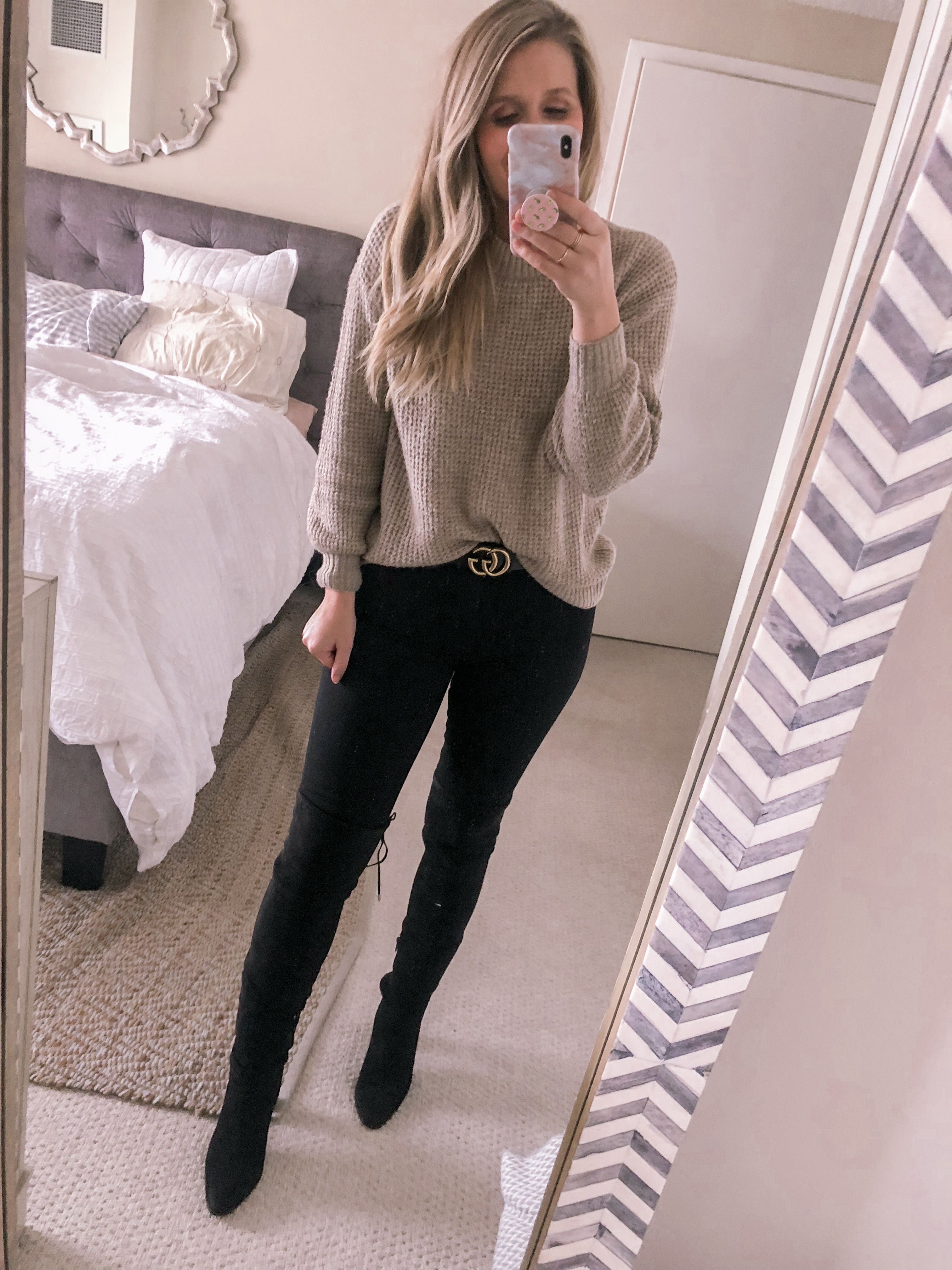 Popular Chicago fashion blogger Visions of Vogue wears the best waffle knit sweater, black skinny jeans, and black over the knee boots for a stylish work outfit.