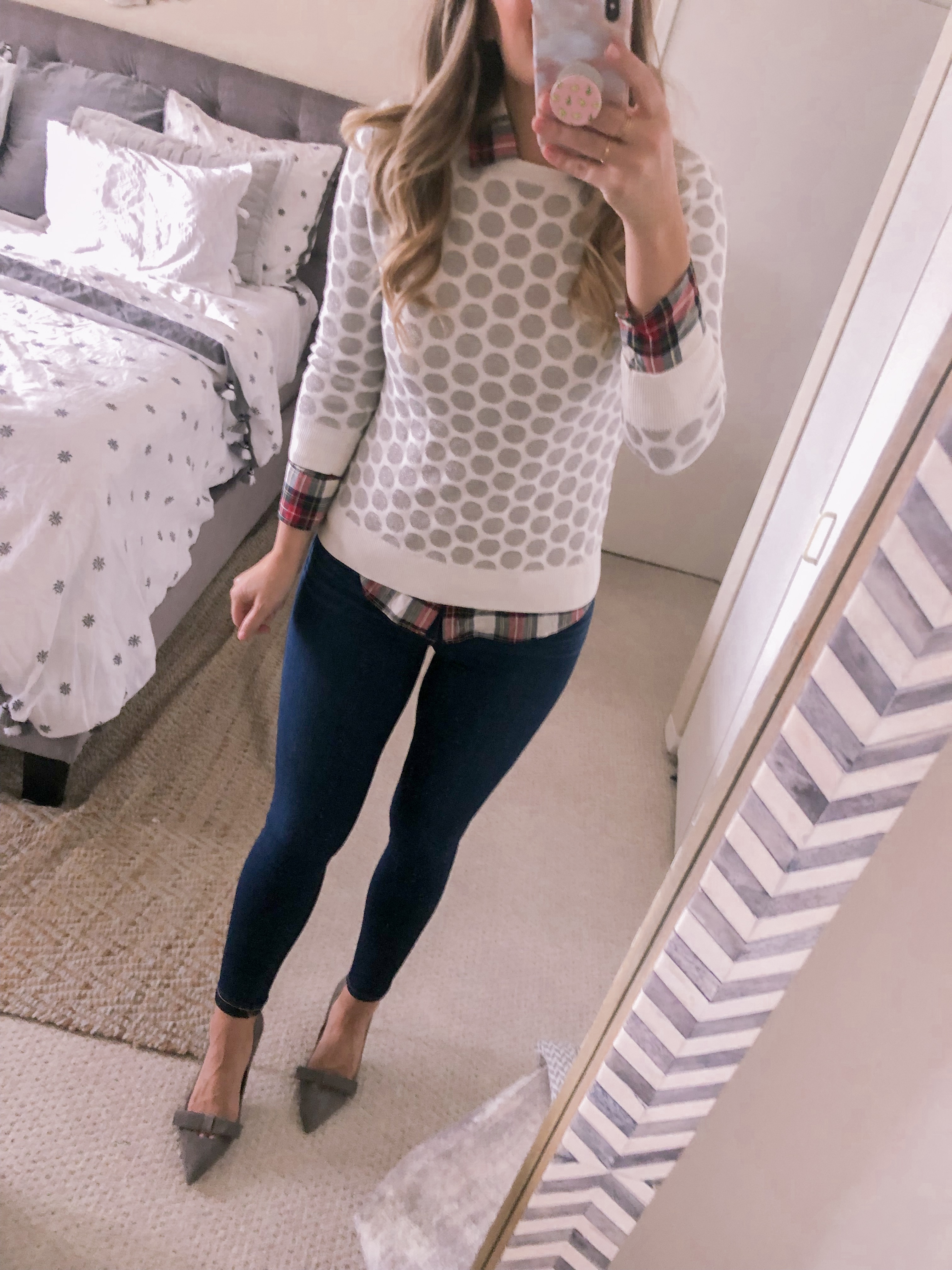 polka dot sweater and plaid shirt for a holiday outfit idea