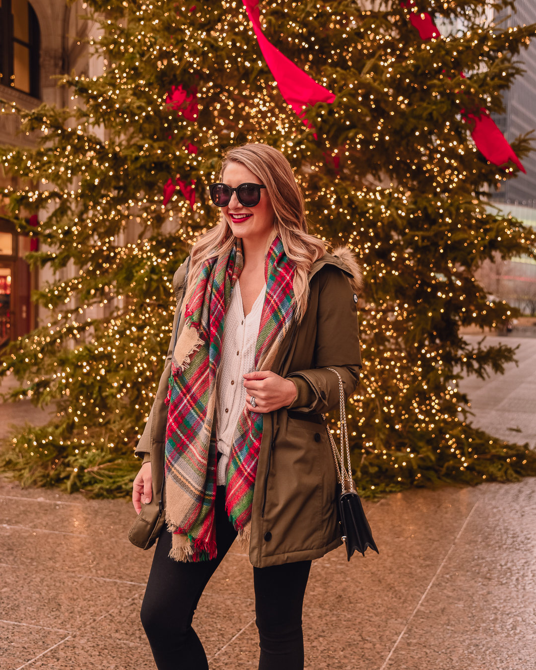 olive puffer coat and a plaid blanket scarf