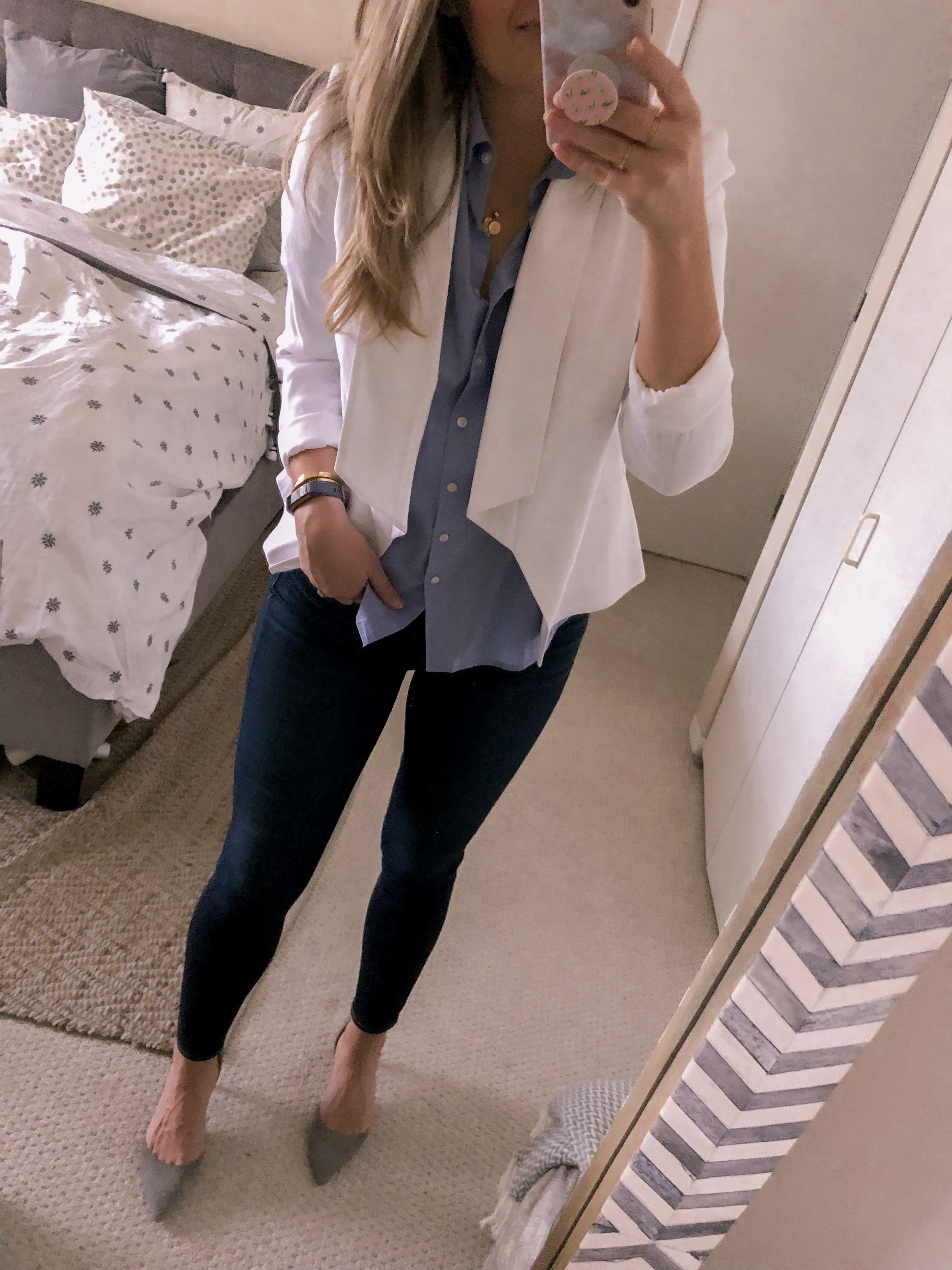 white blazer and a blue button down shirt