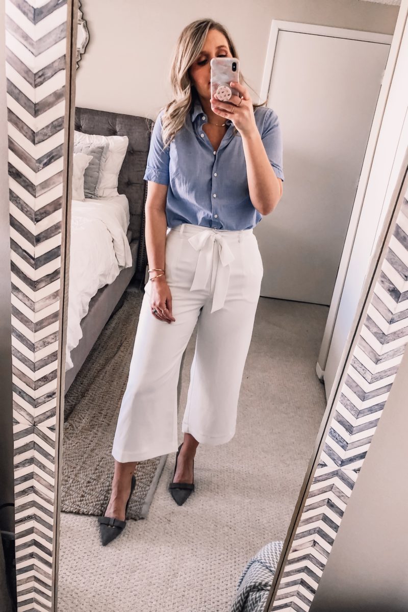 white wide leg pants and a blue button down shirt