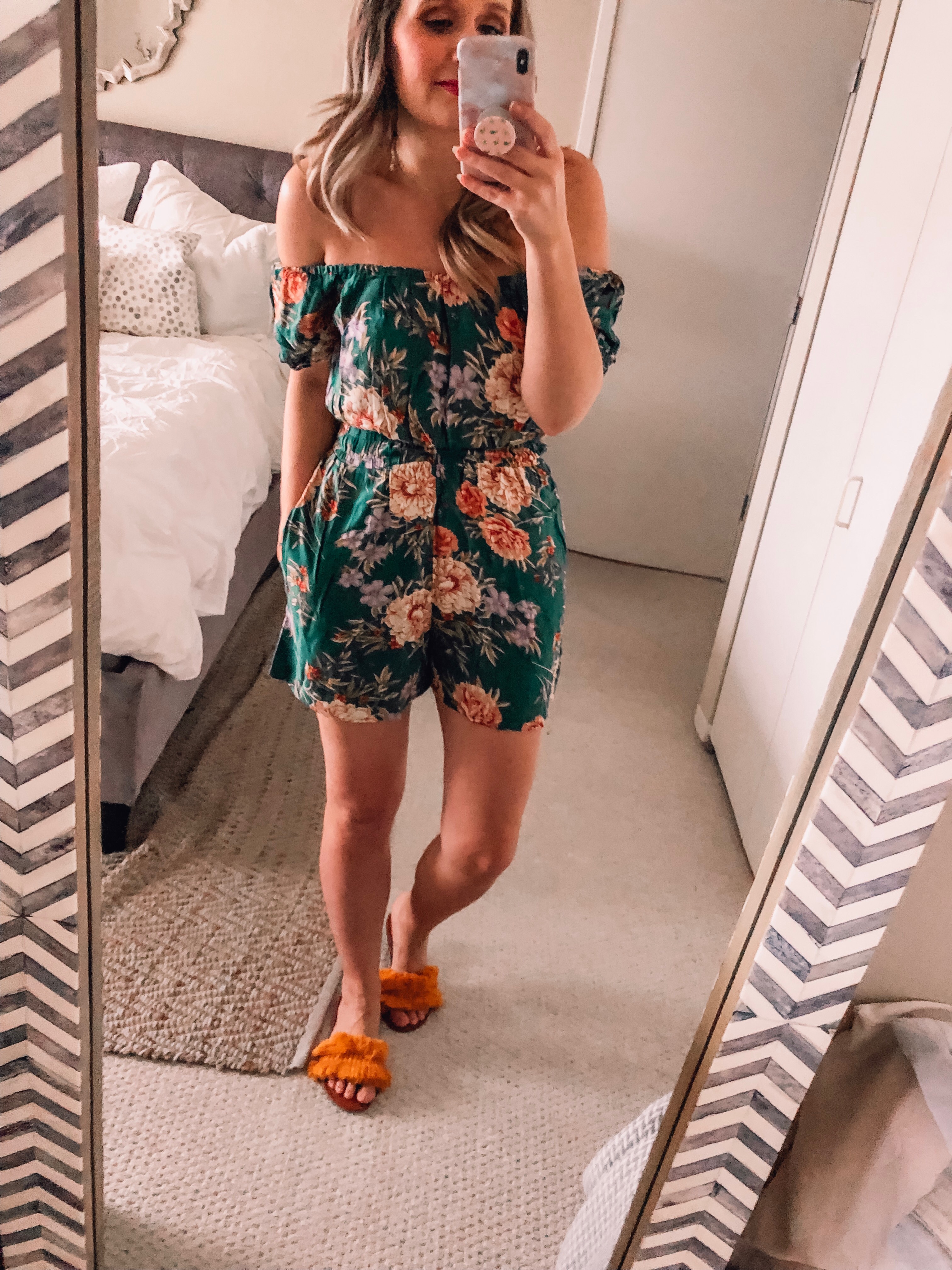 green floral romper that is off the shoulder 