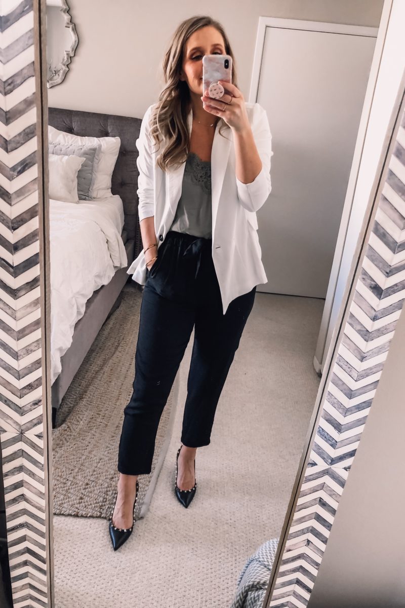 white blazer, black work pants, and green lace top