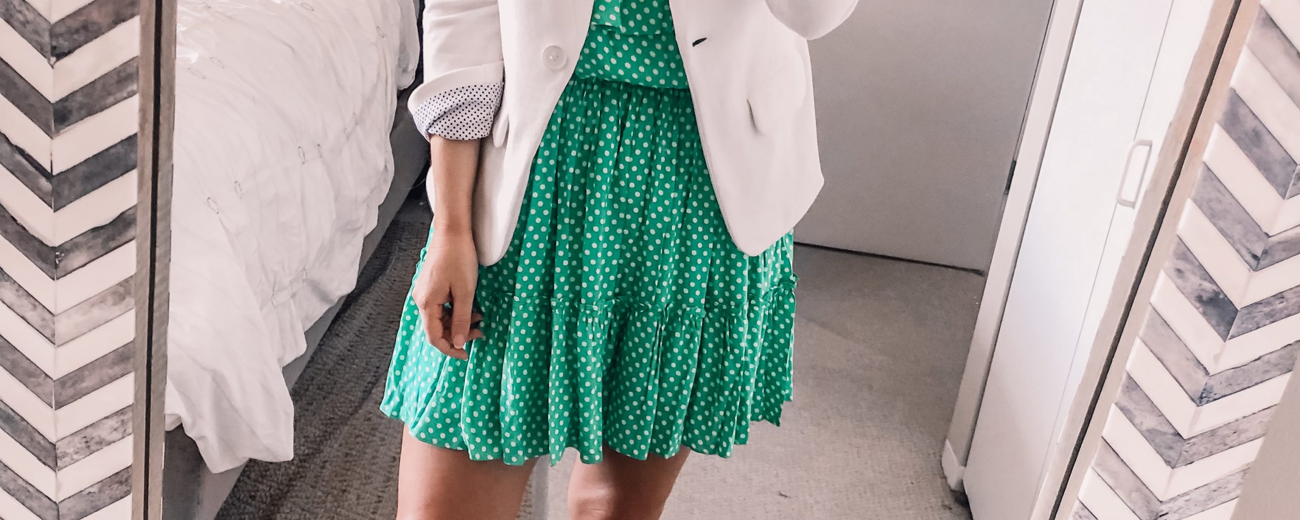 green wedding guest dress with a white blazer