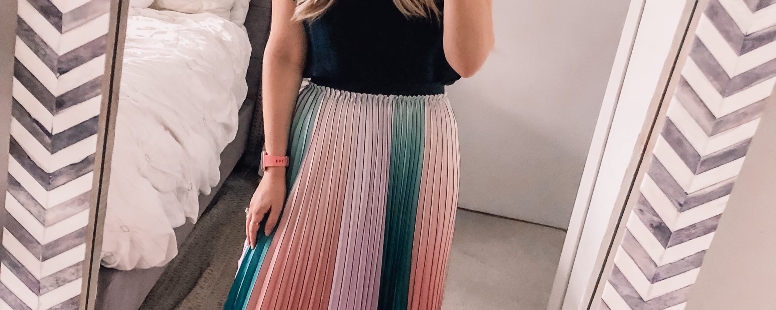 colorful pleated skirt and black blouse