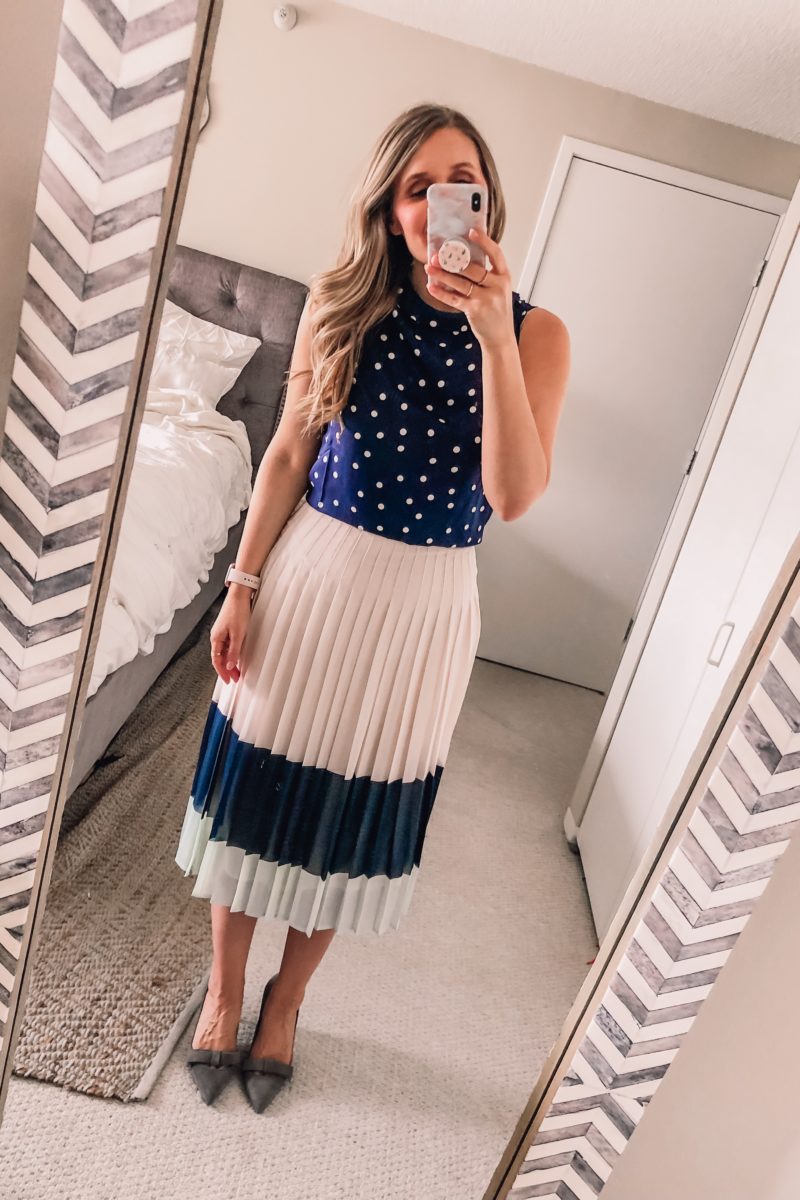 polka dot top and pleated navy skirt