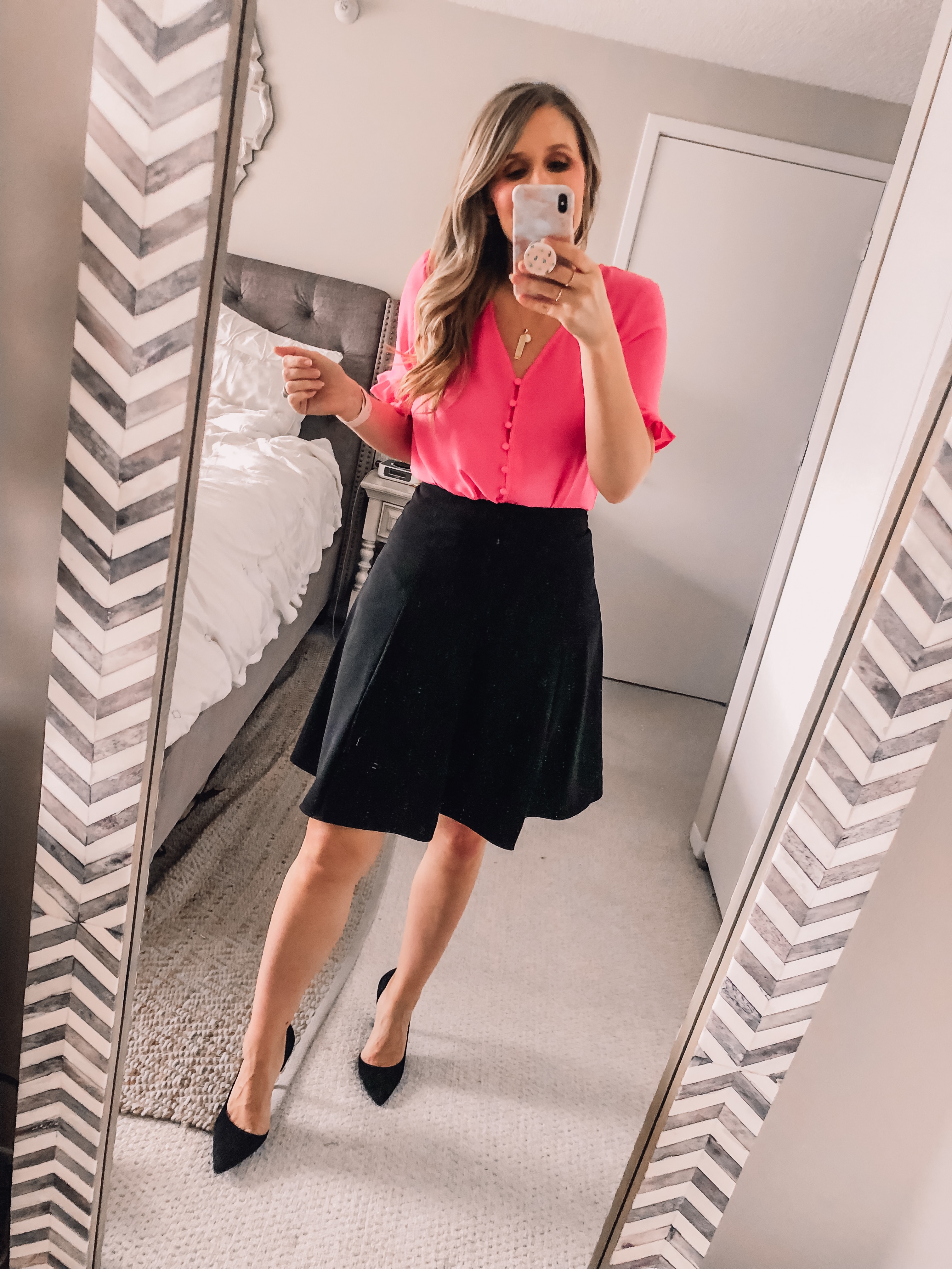 Pink button front top with a black a link business skirt