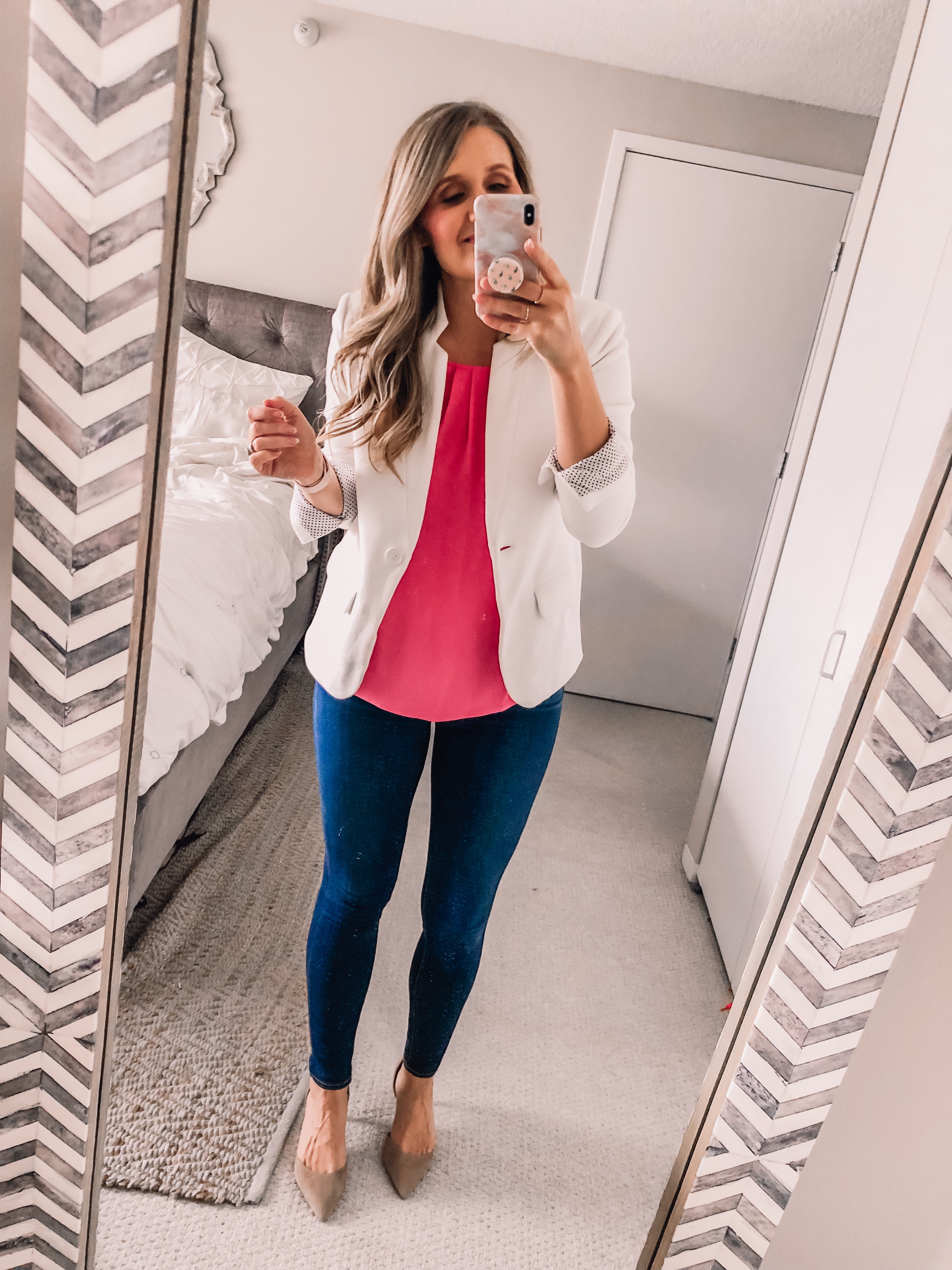 pink date night top and a white blazer