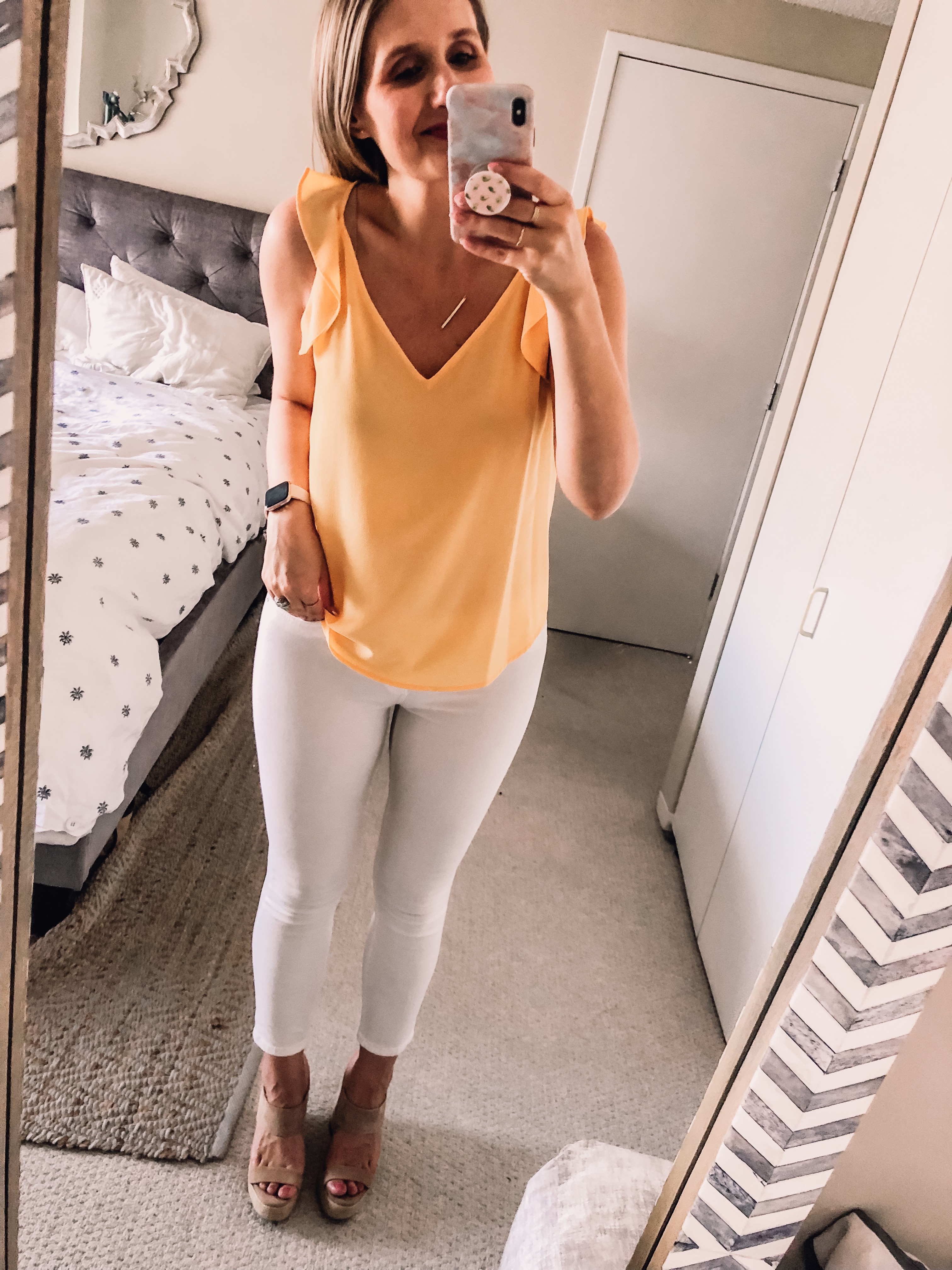 yellow ruffle blouse with white skinny jeans and beige DSW wedges