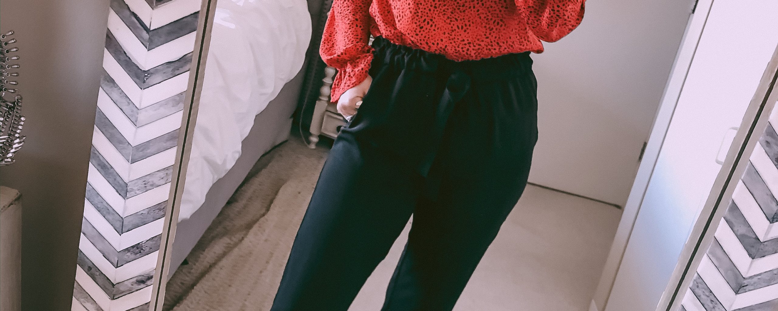 red blouse with black paperbag pants