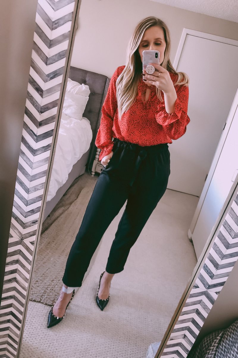 red blouse with black paperbag pants