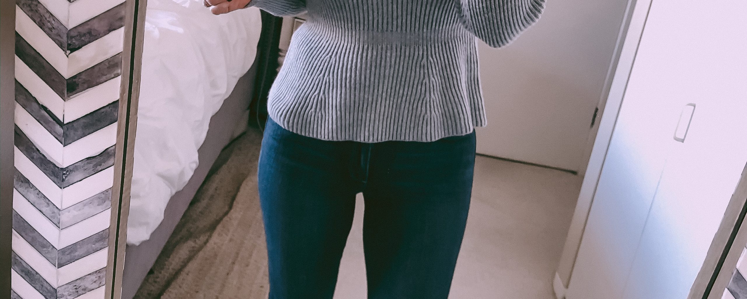 grey peplum sweater and dark wash skinny jeans