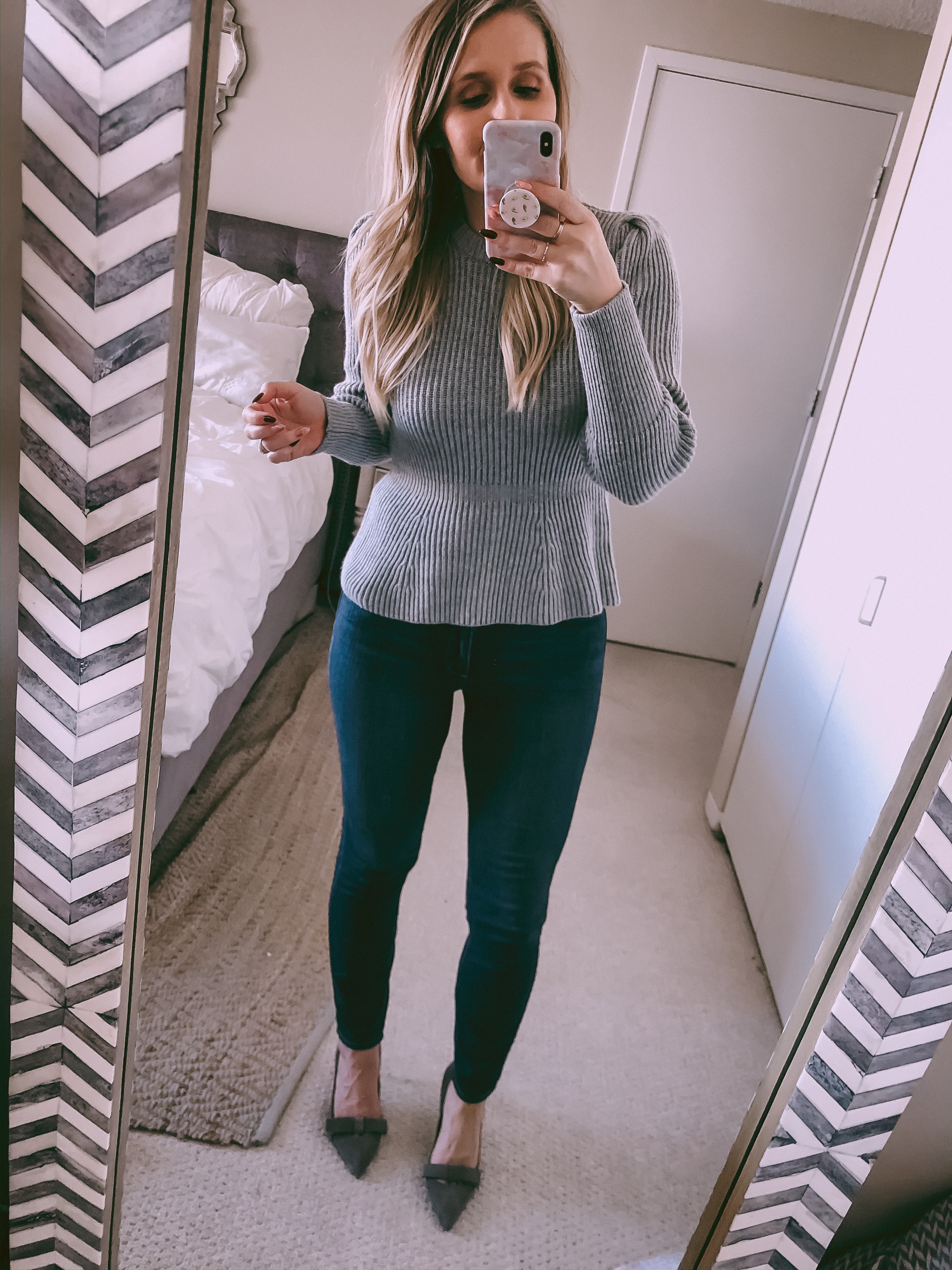 grey peplum sweater and dark wash skinny jeans