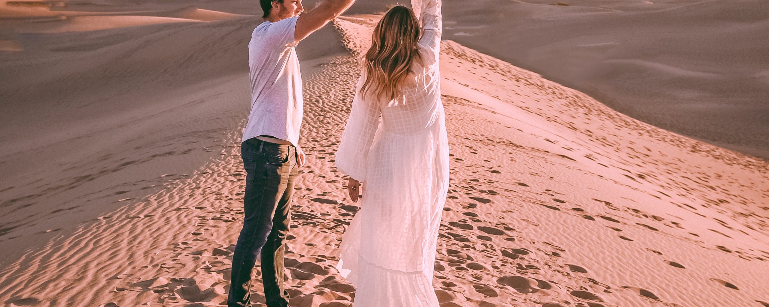 couple engagement photo shoot in the sand dunes of death valley