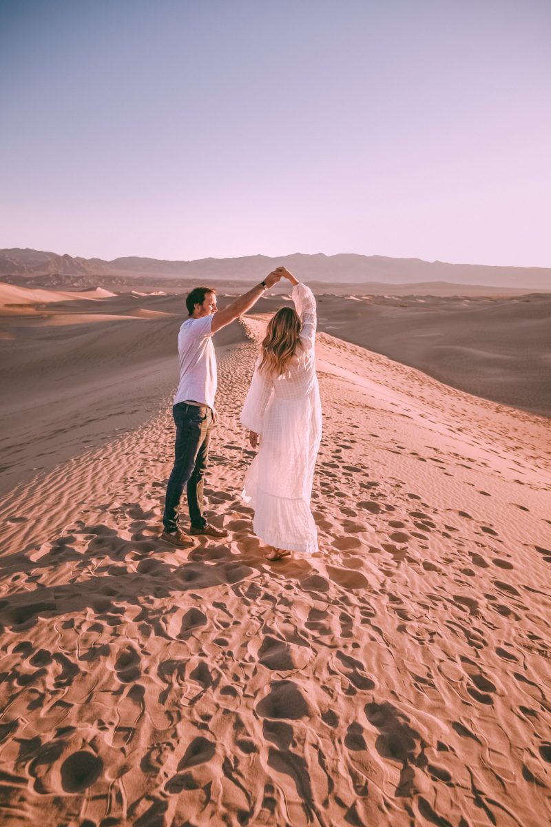 couple engagement photo shoot in the sand dunes of death valley