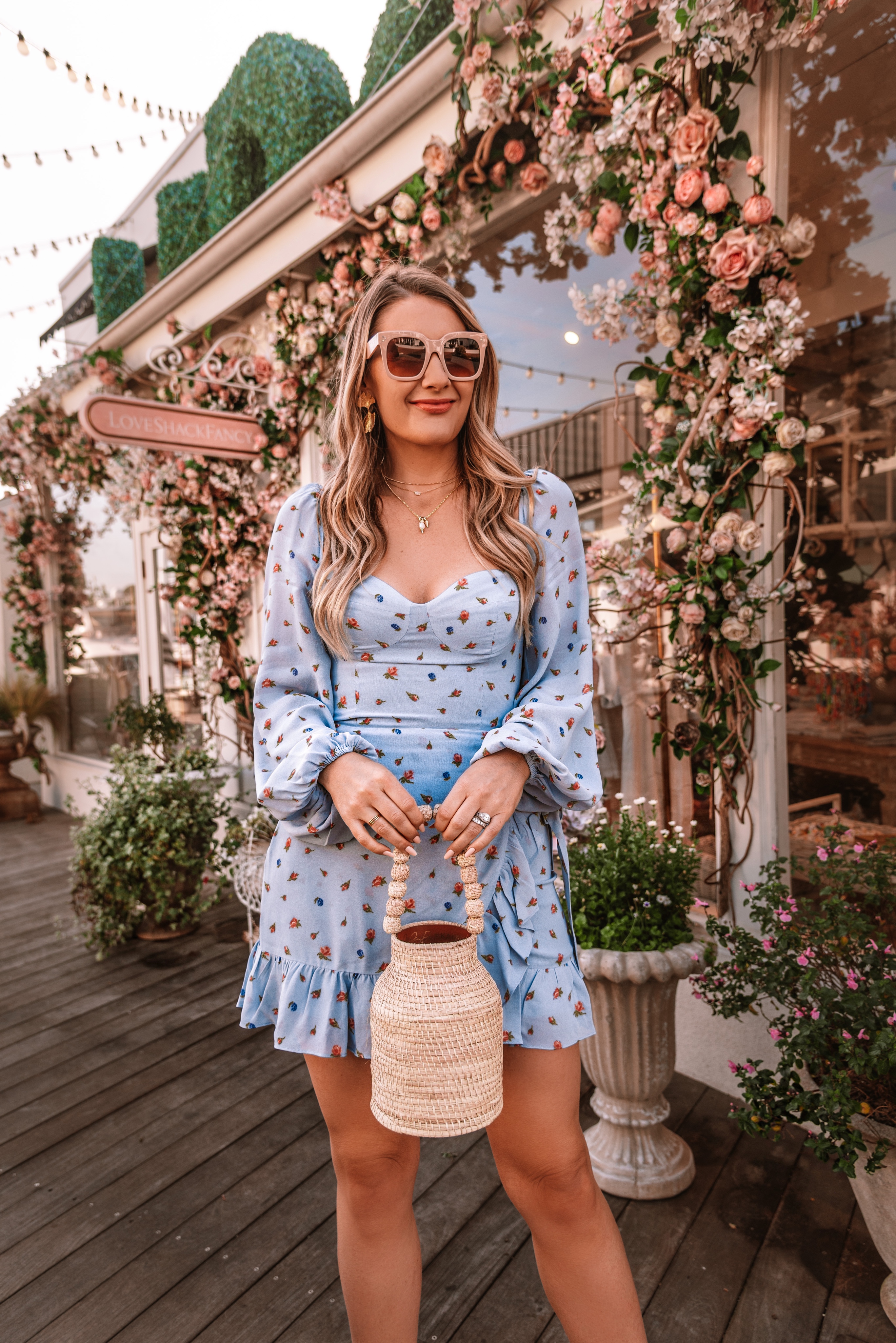 Cute blue long sleeve floral print dress by Reformation, a sustainable fashion brand. 