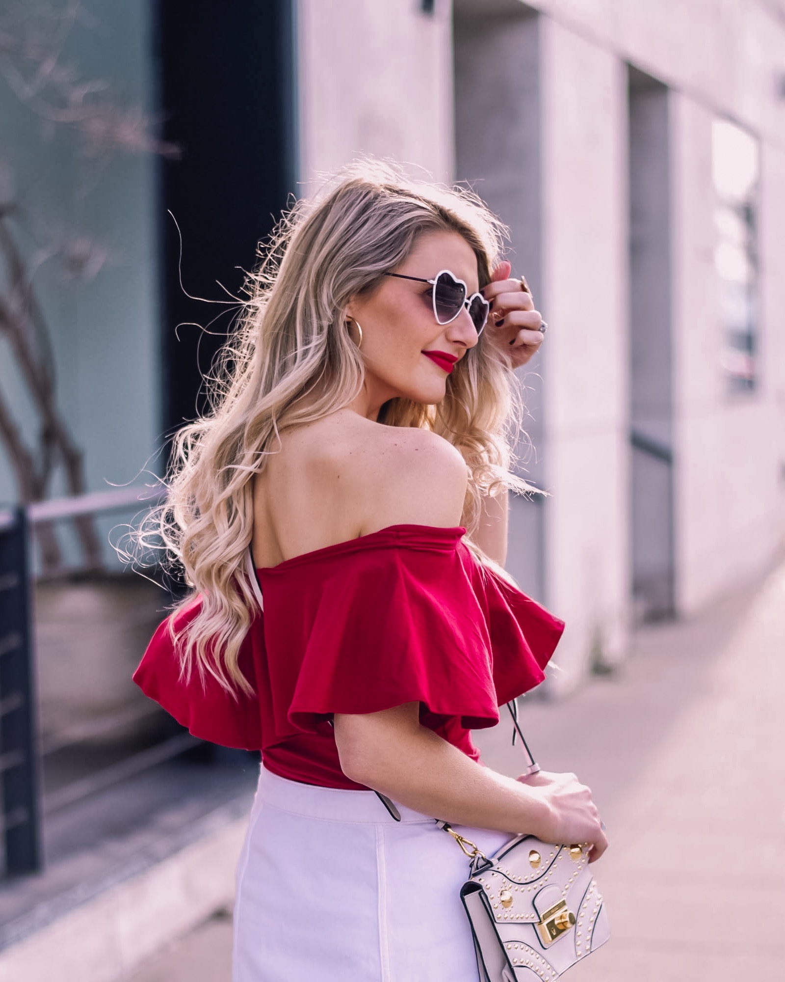 red ruffle top with a white mini skirt