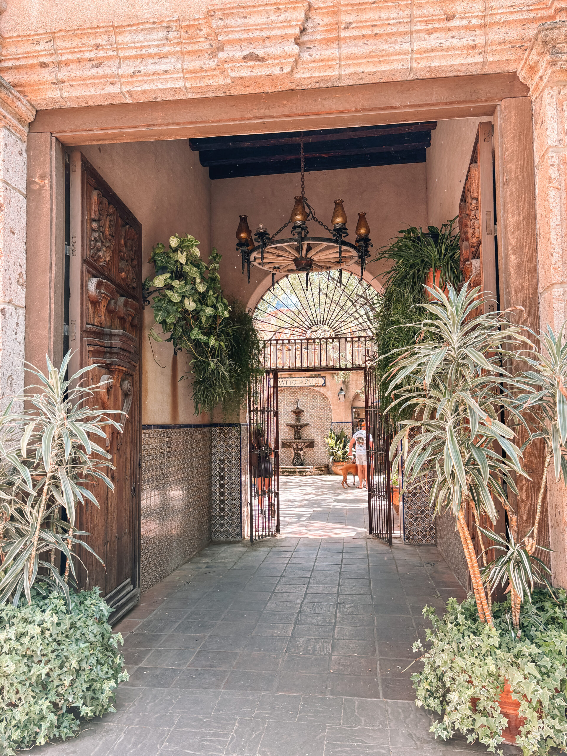 Charming courtyard at Tlaquepaque Arts & Crafts Village in Sedona, Arizona with Spanish-style architecture, art galleries, and boutique shops