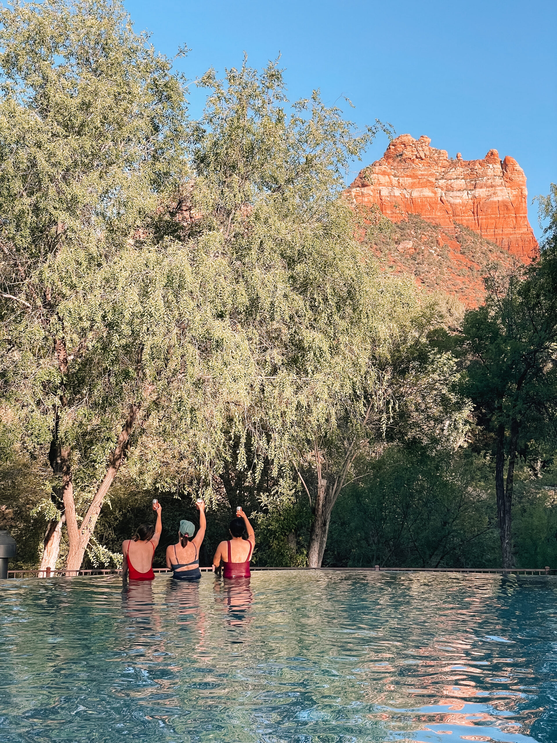 Luxury spa and pool area in Sedona, Arizona with red rock views, relaxing lounge chairs, and serene desert setting